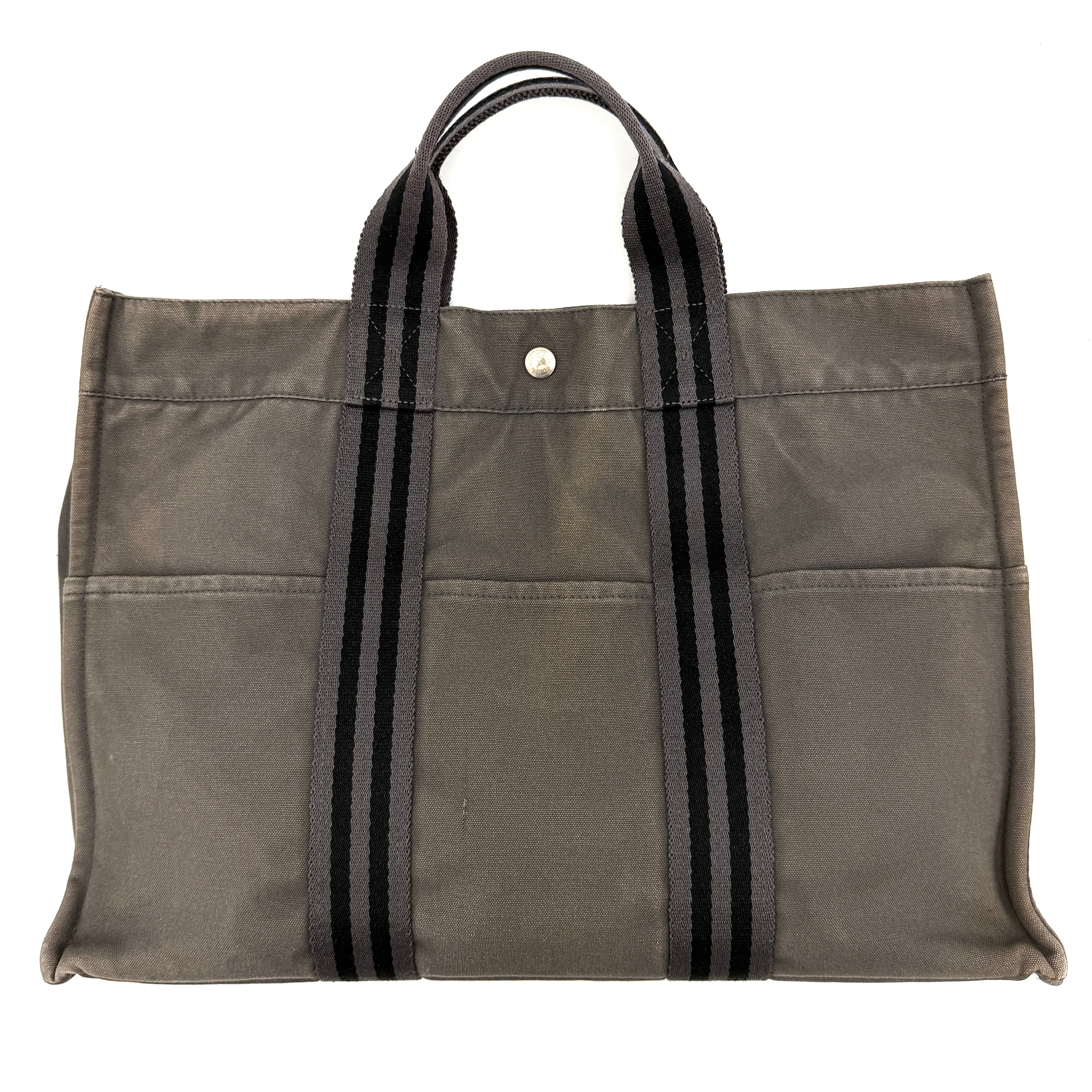 Hermès Fourre Tout MM tote bag in black and grey canvas with striped handles and snap-button closure