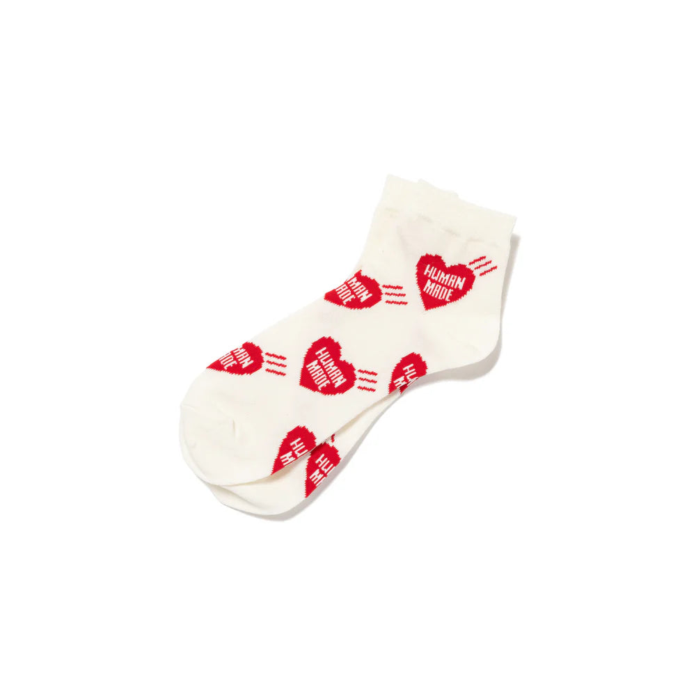 Human Made short socks in white with red heart pattern, showcasing playful and elegant design.