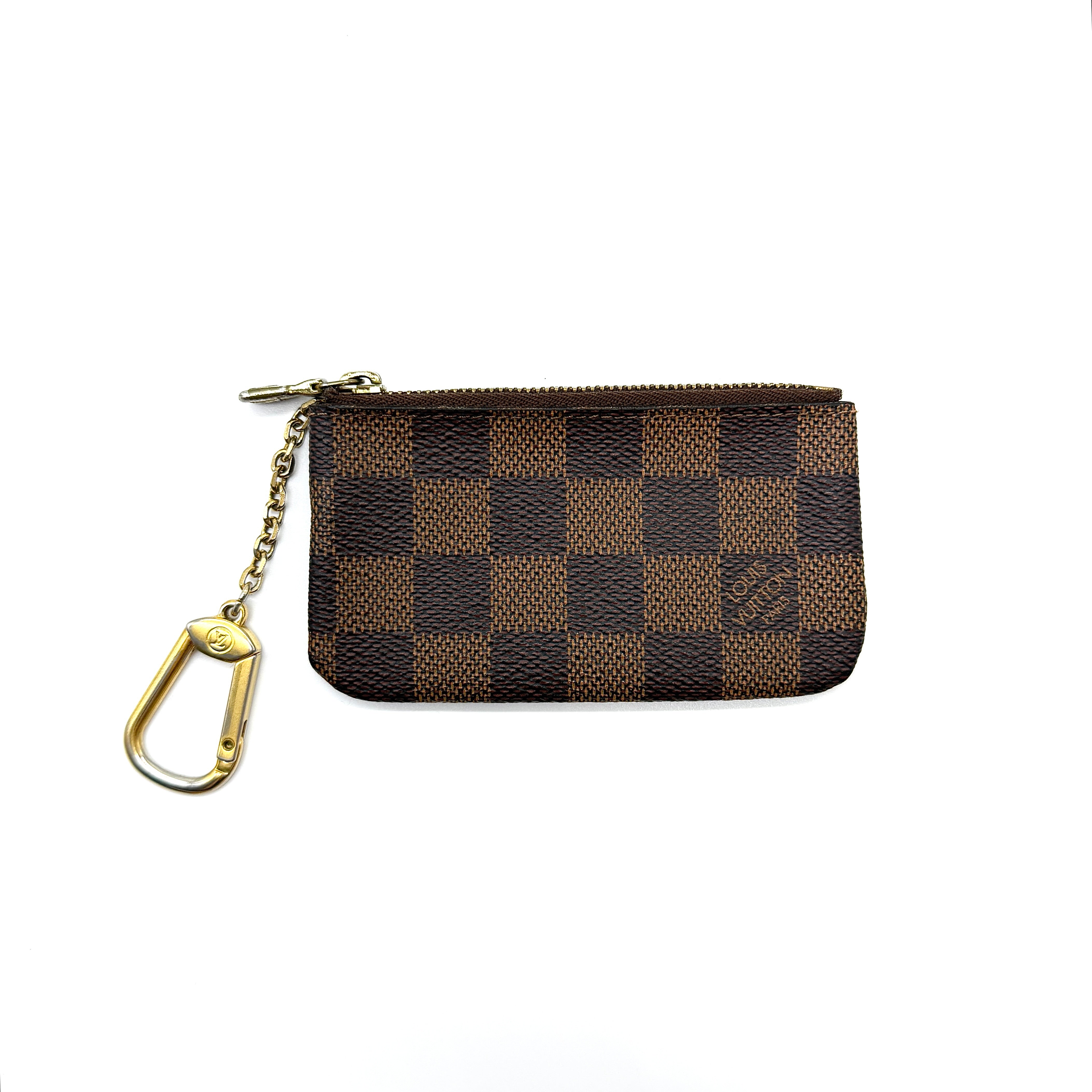 Louis Vuitton Damier Ebene coin pouch with gold-tone zip and chain clasp.