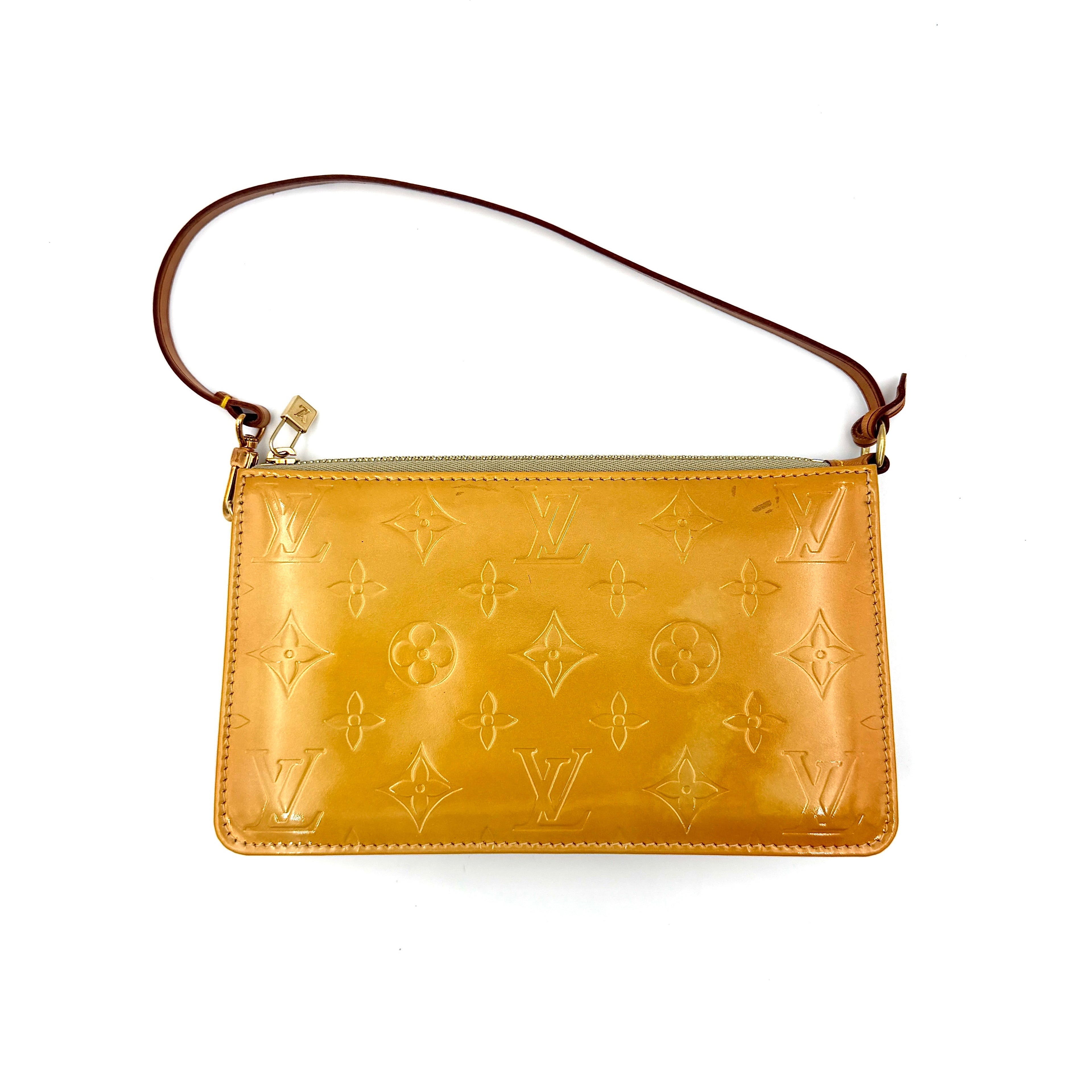Louis Vuitton Lexington pochette bag in yellow patent leather with embossed monogram pattern shown from the front with single leather shoulder strap