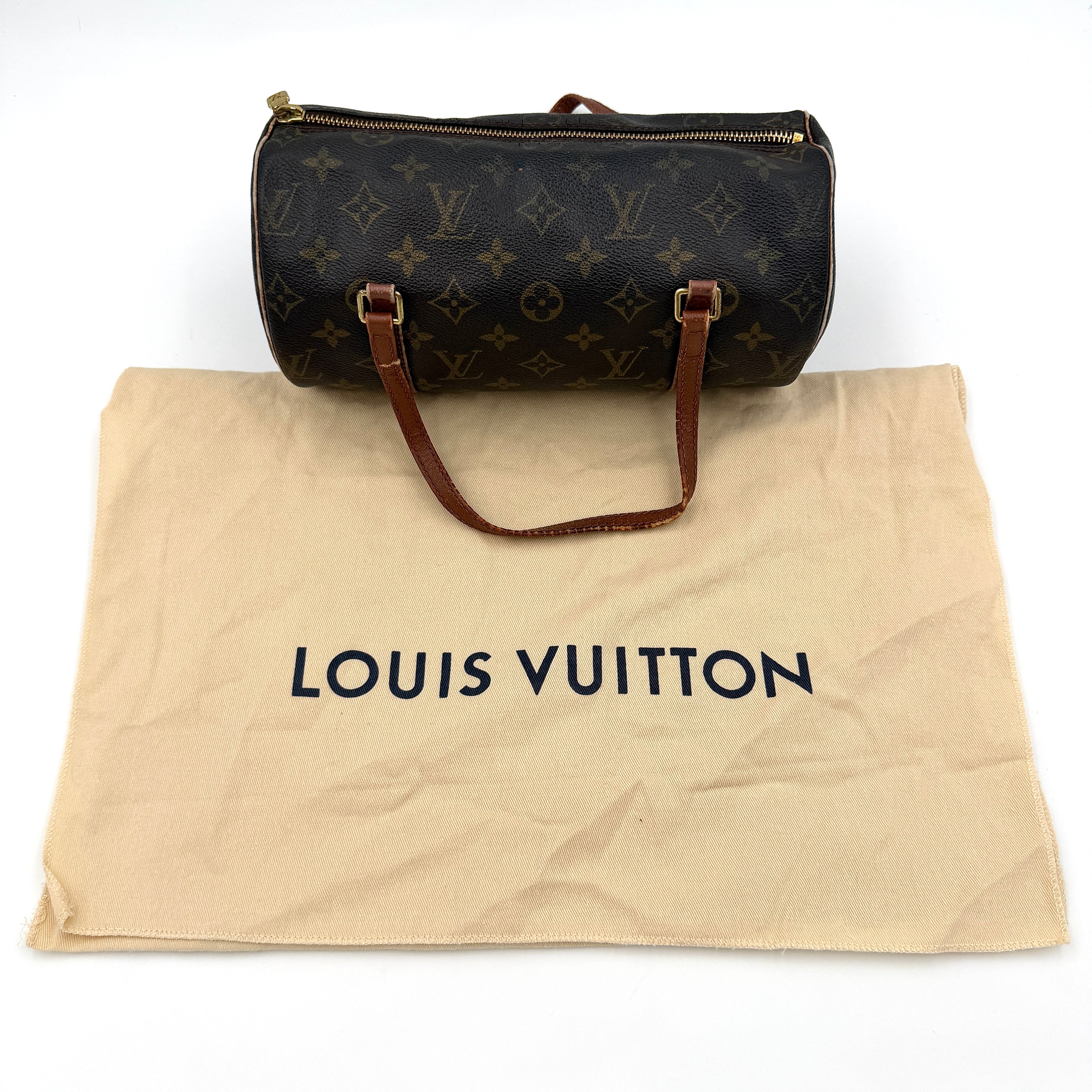Louis Vuitton Monogram Papillon handbag in brown coated canvas with vachetta leather trim and gold-tone hardware.