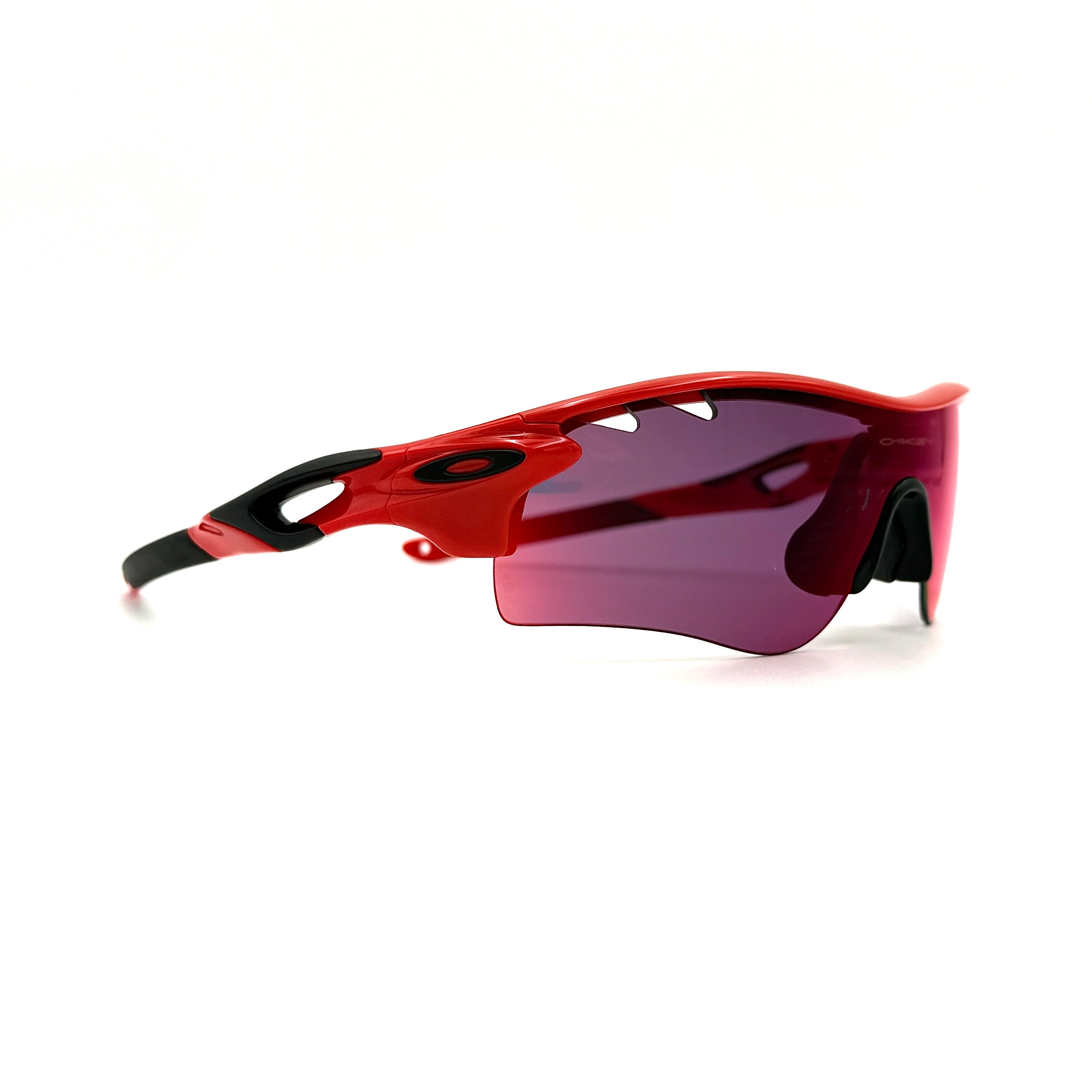 Oakley Radarlock Path Prizm sunglasses in red with a sporty design, featuring Prizm lenses and a streamlined silhouette