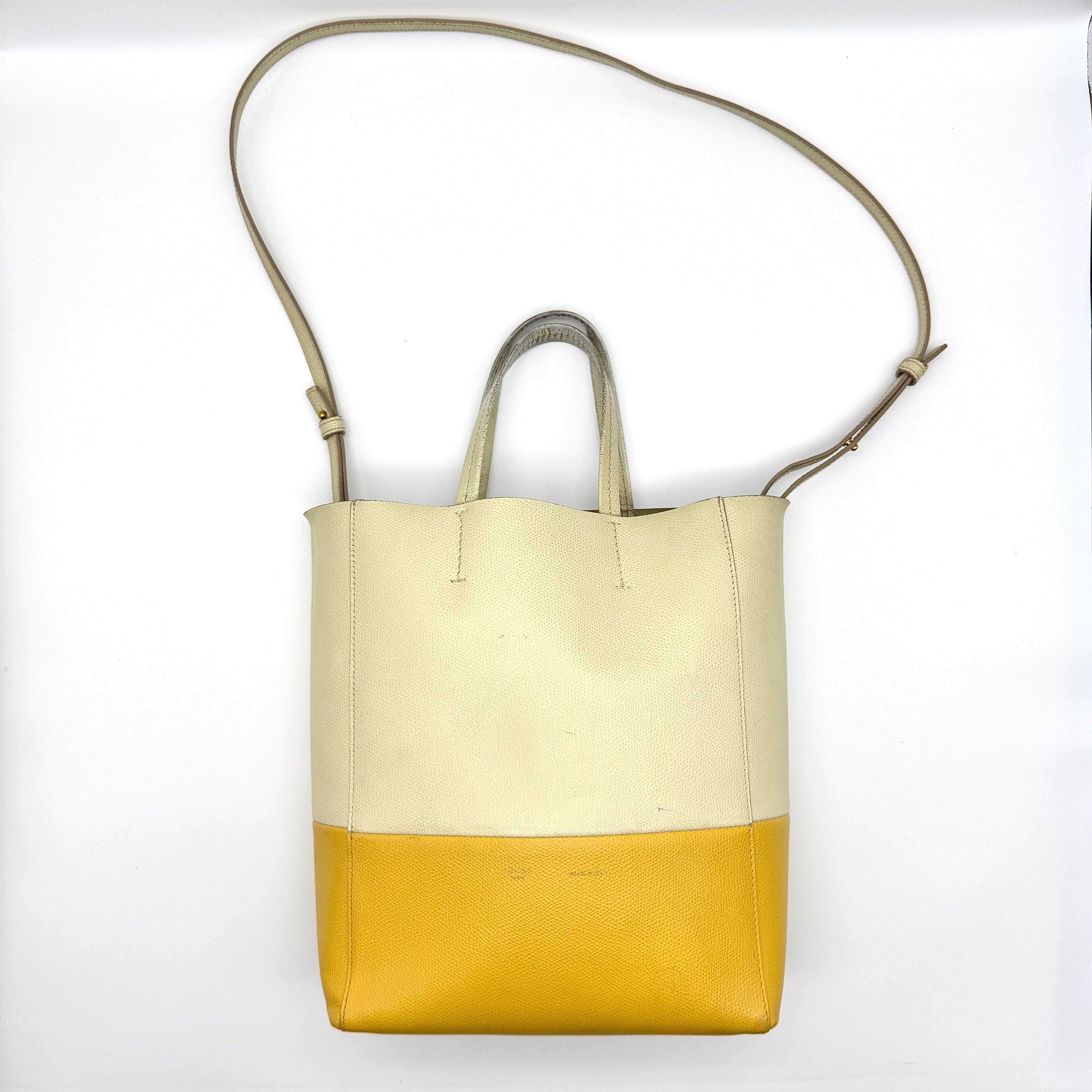 Celine Vertical Cabas Bicolor Tote Bag in yellow and white grained leather with gold-tone hardware and dual handles