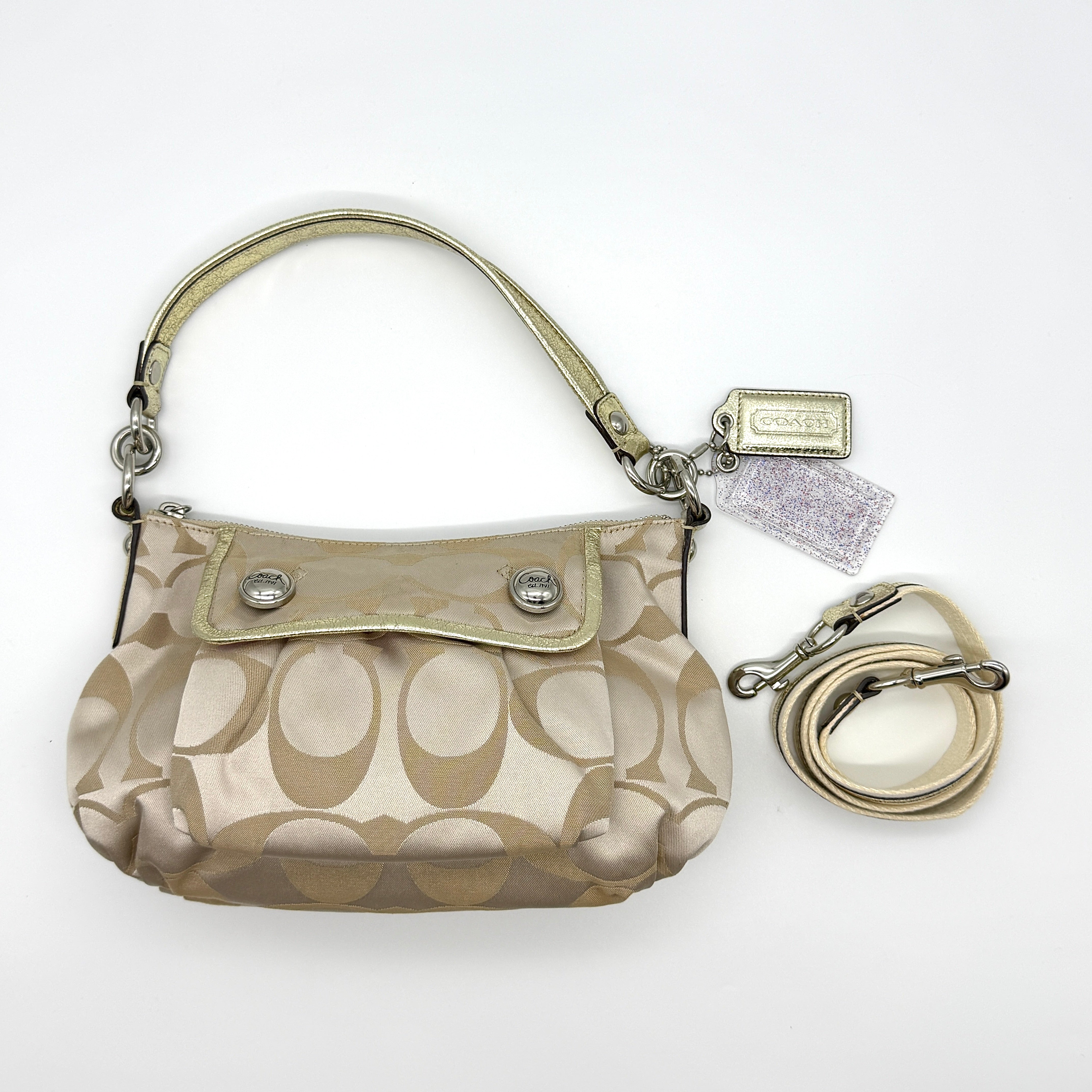 Coach 2Way Signature Shoulder Bag in cream jacquard canvas with gold leather trim, silver-tone hardware, and pink satin interior