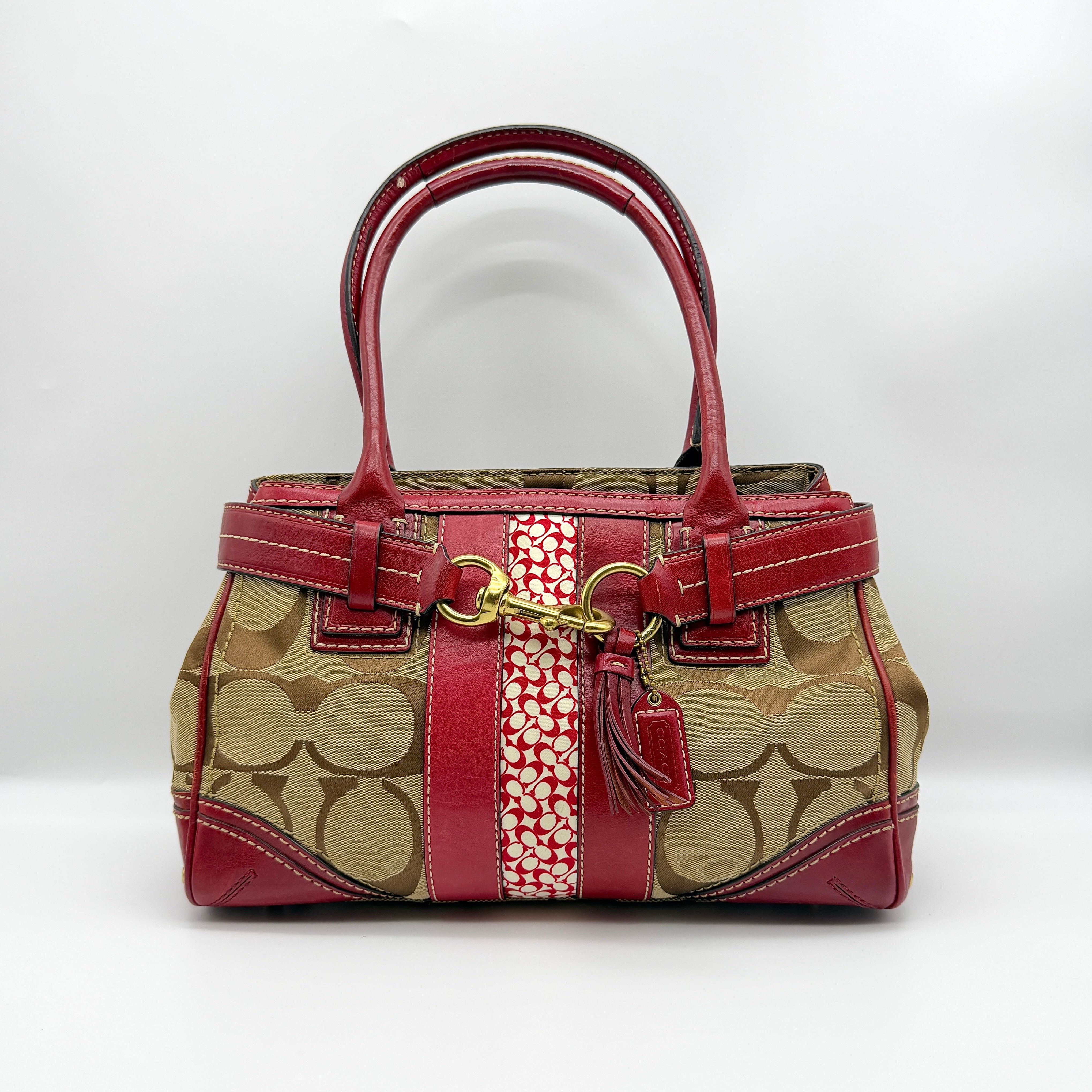 Coach Signature Hampton Carryall Shoulder Bag in beige jacquard with red leather trim, gold-tone hardware, and horsebit accent.