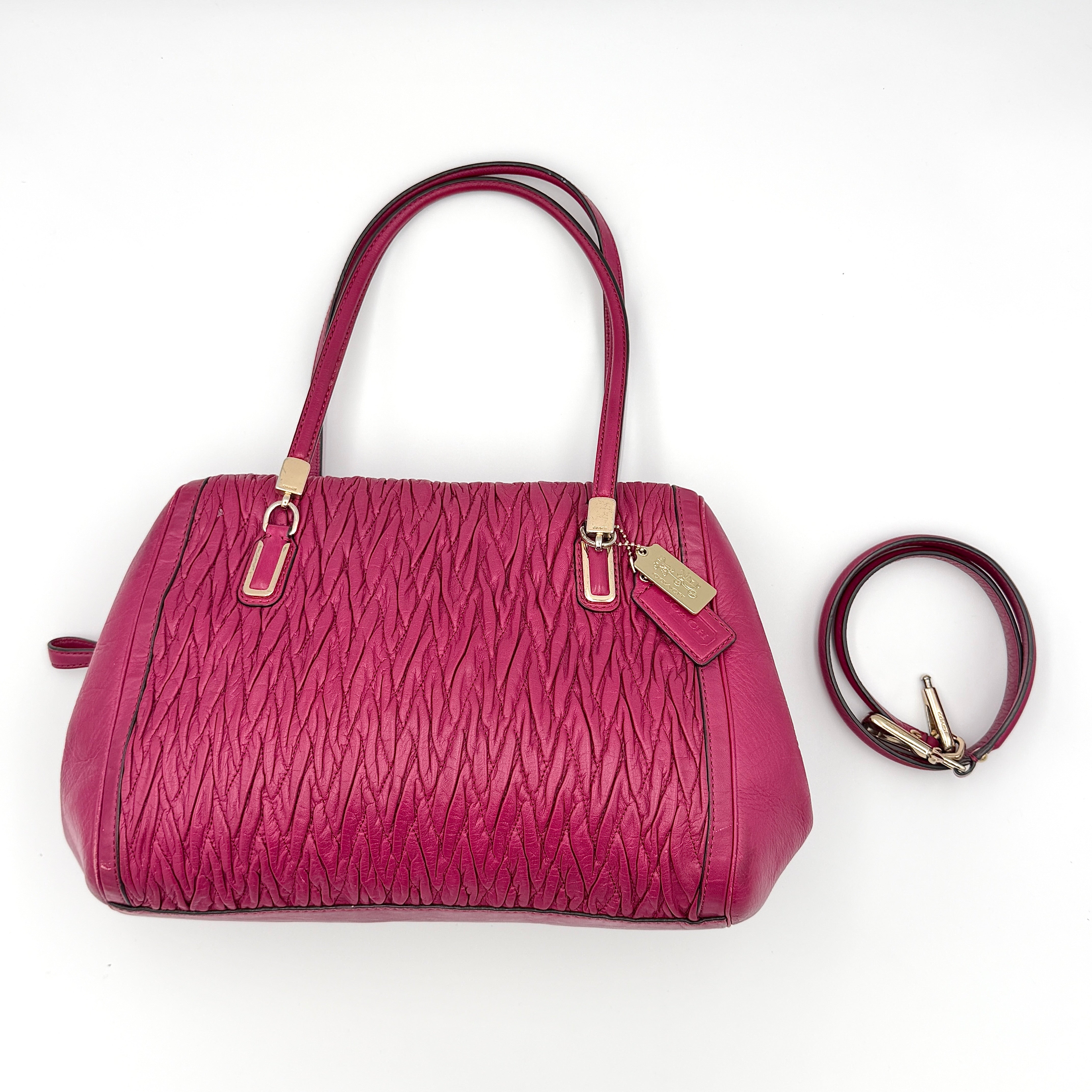 Coach Madison Gathered Twist Madeline Satchel Handbag in vibrant pink leather with gold-tone hardware and detachable strap.