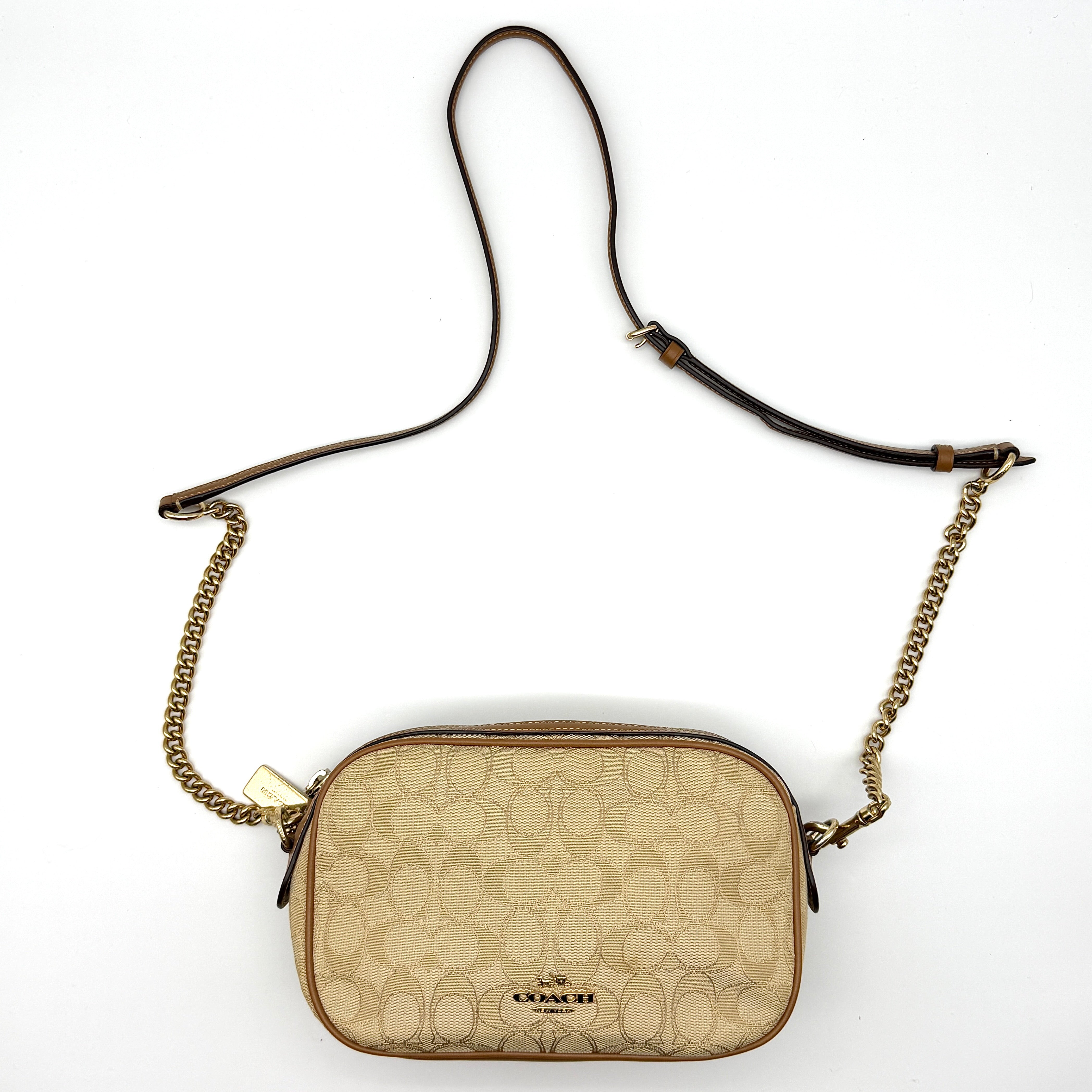 Coach Signature Isla Chain Crossbody Bag in beige monogram canvas with brown leather trim and gold-tone chain strap