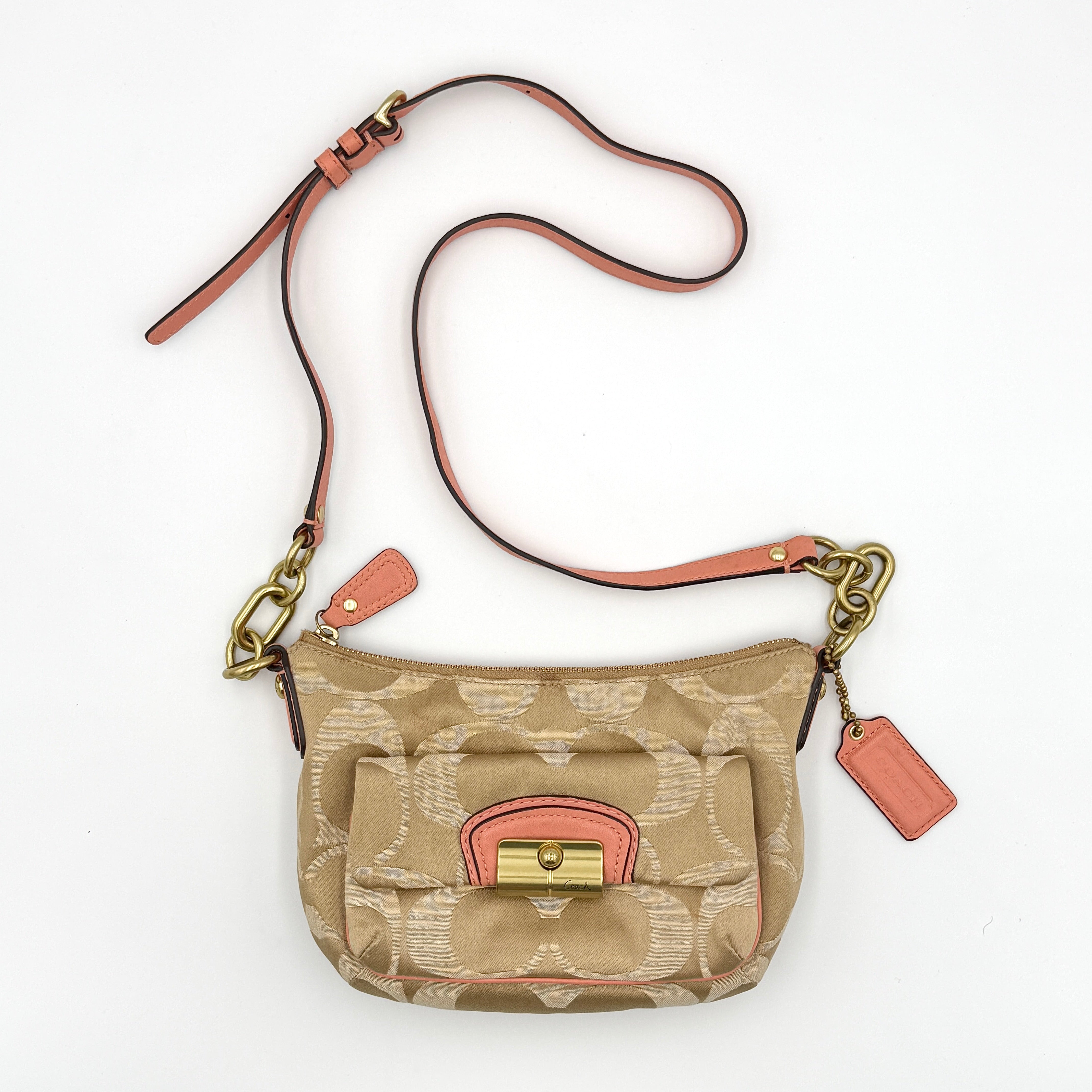 Coach Signature Kristin Crossbody Bag in beige monogram jacquard with pink leather trim and gold-tone push-lock closure