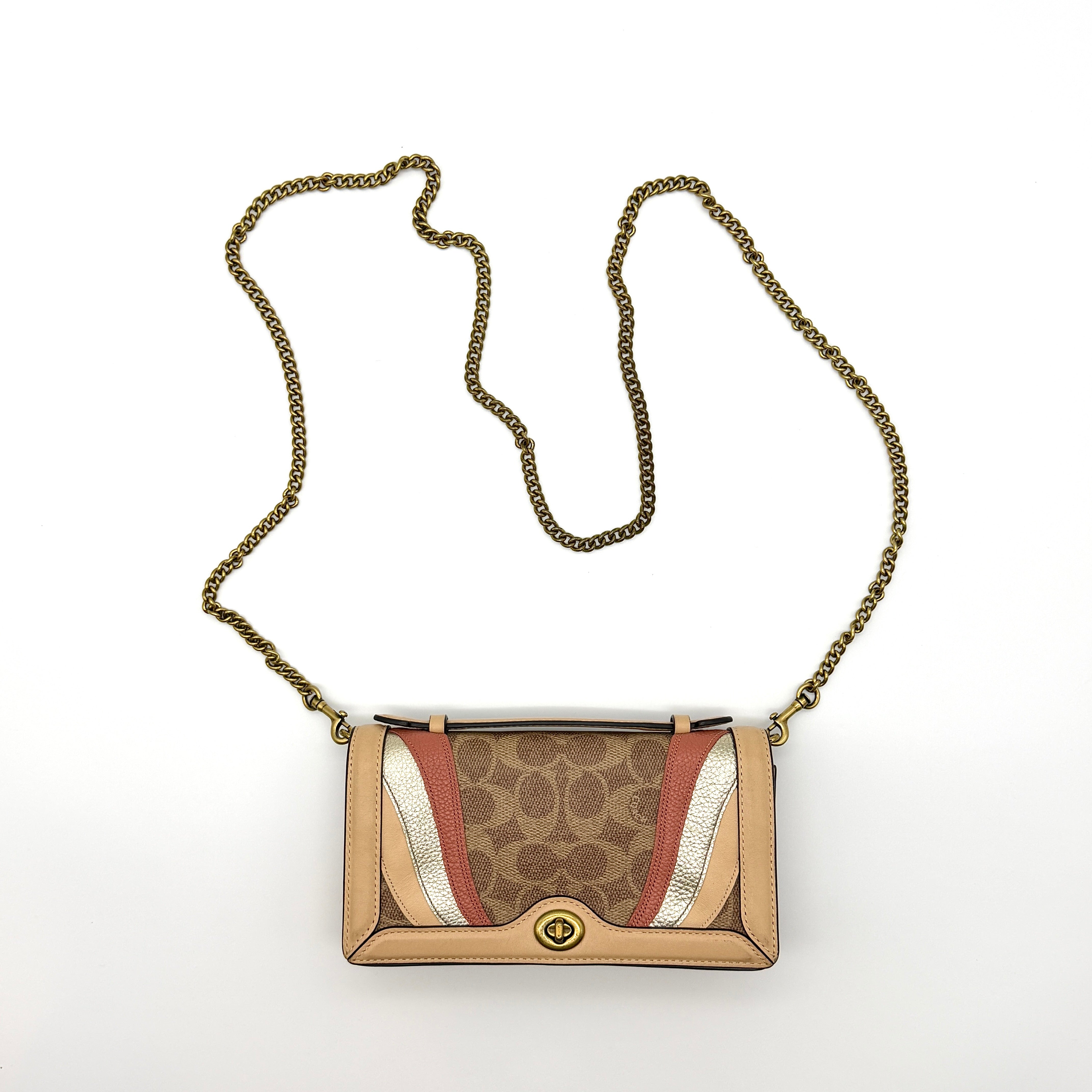 Coach Signature Riley Chain Clutch Shoulder Bag in beige monogram canvas with coral pink and gold leather panels and antique gold chain strap