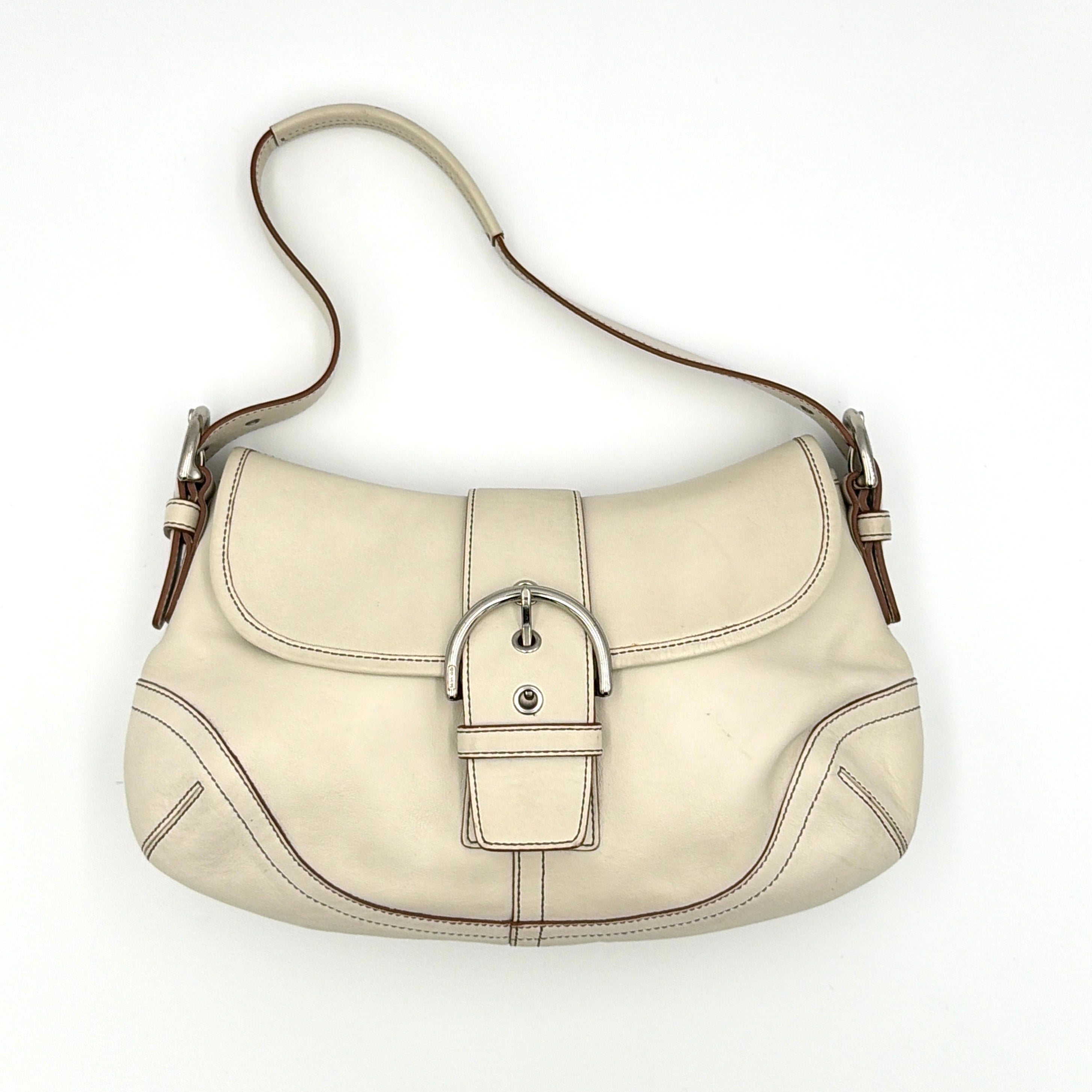 Coach Y2K Signature Soho Buckle Shoulder Bag in smooth cream leather with silver-tone hardware and contrast stitching