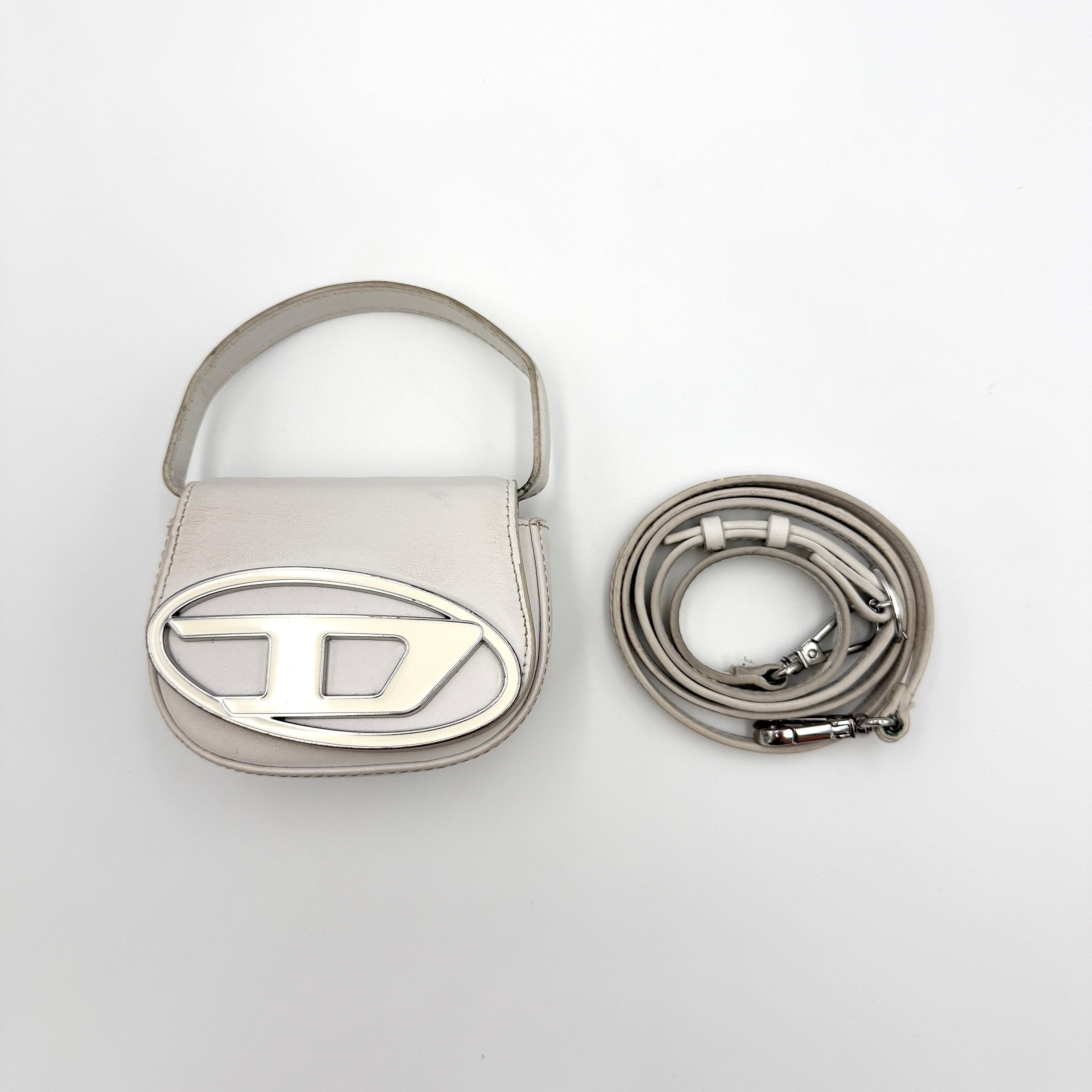 Diesel 1DR-XS Mini Bag in white leather with silver-tone oval logo plaque and detachable crossbody strap