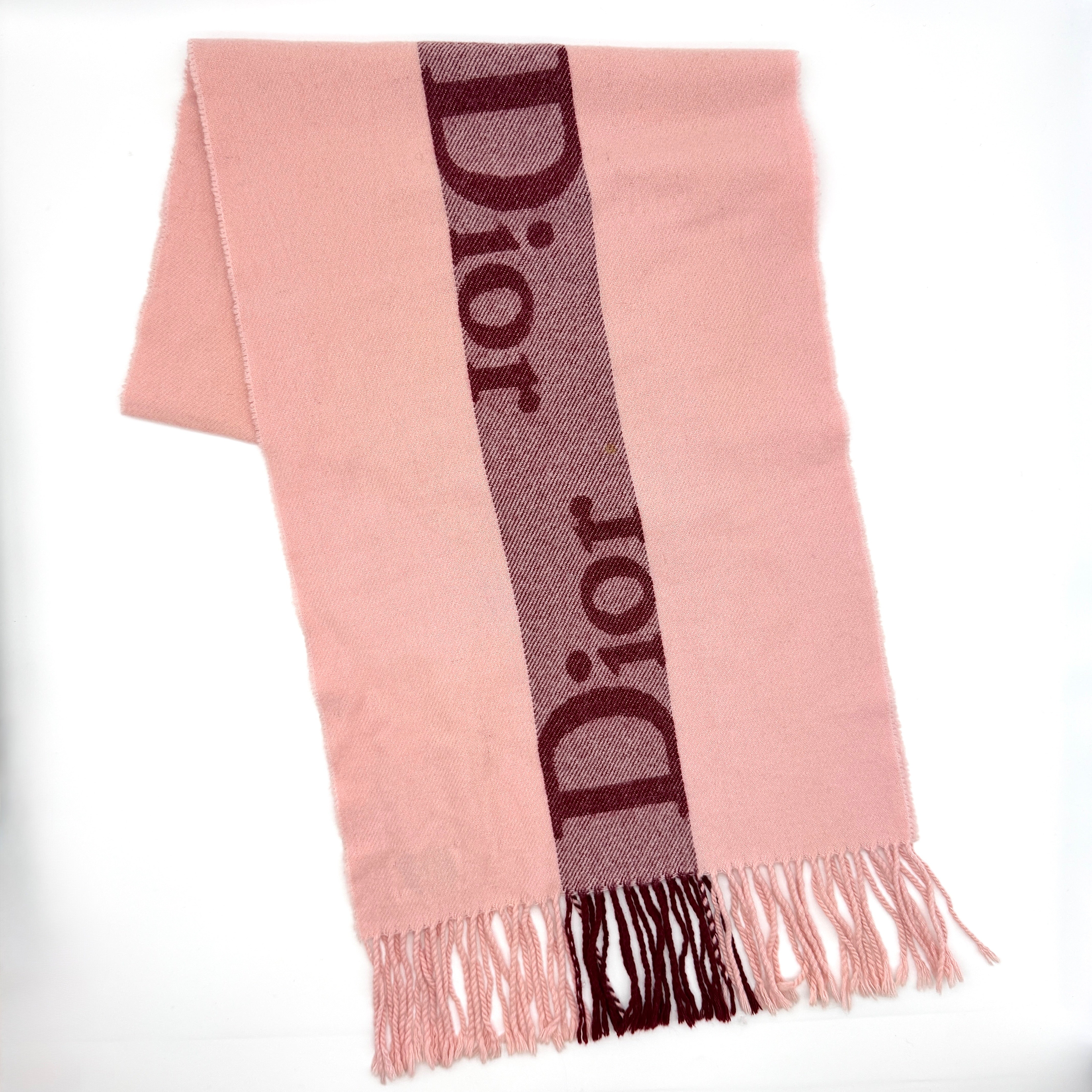 Dior Spell Out Logo Scarf in pink and burgundy, crafted from lambswool and cashmere with fringe ends