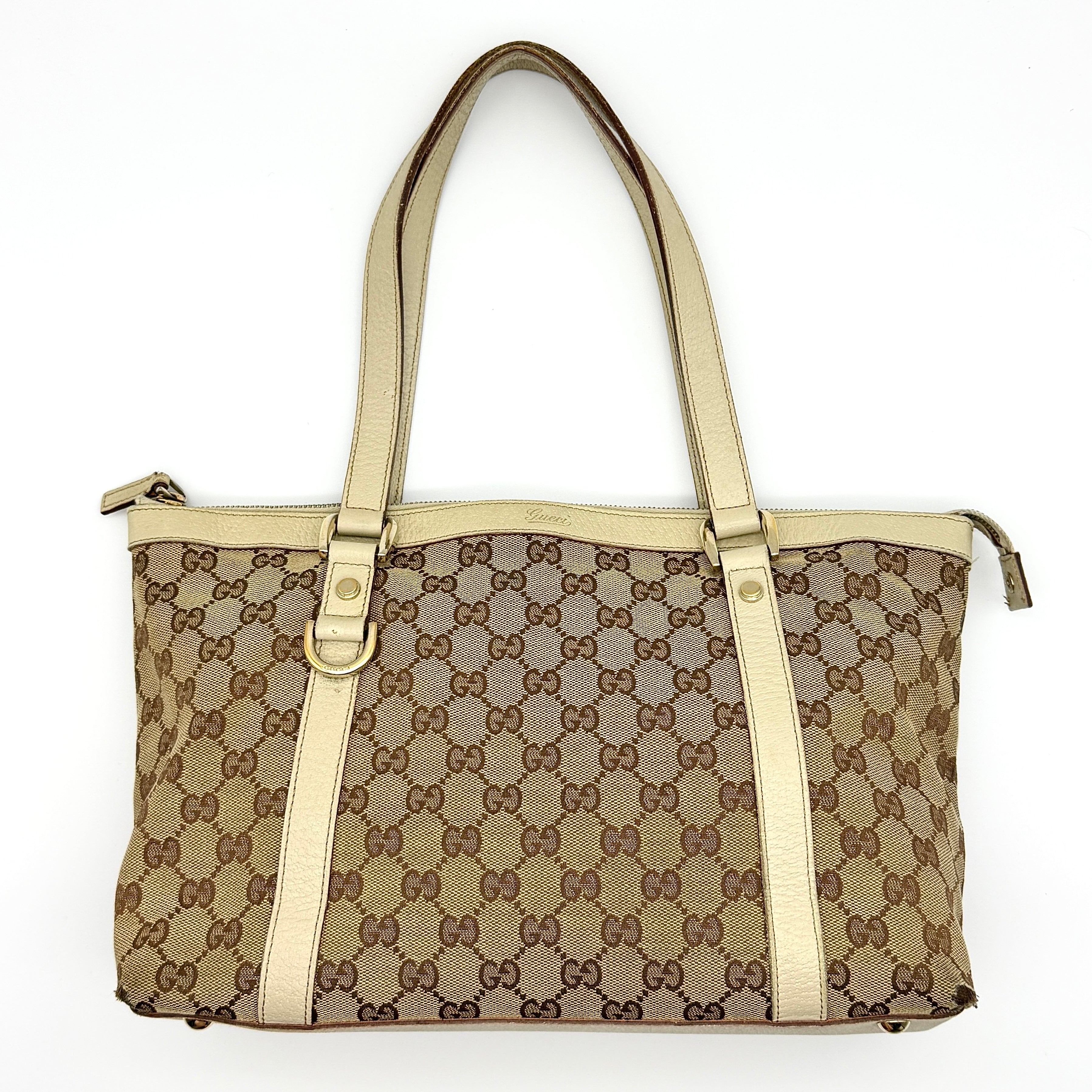 Gucci GG Monogram Abbey Shoulder Bag in beige canvas with cream leather trim and gold-tone hardware.