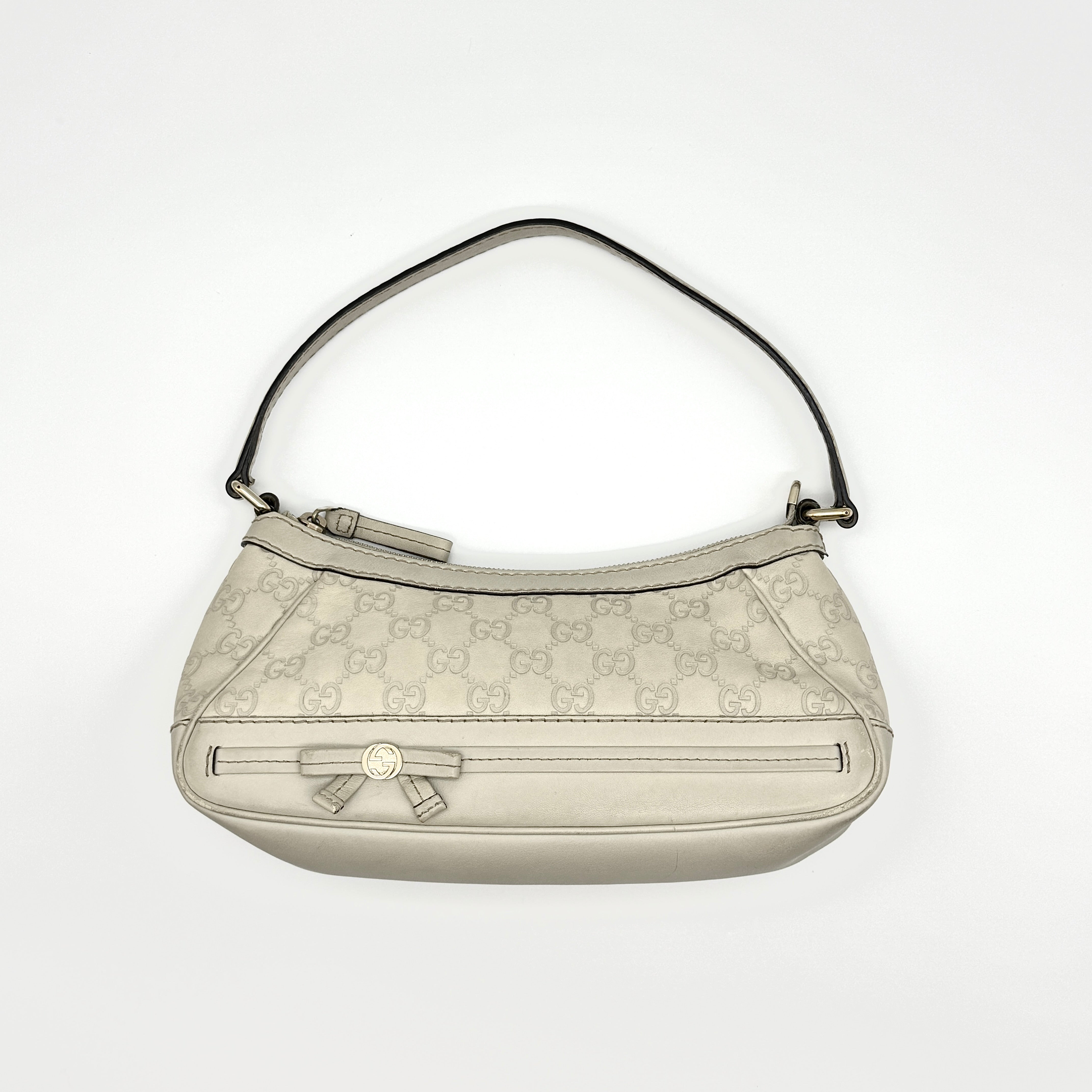 Gucci Guccissima Mayfair Ribbon Shoulder Bag in ivory leather with gold-tone GG logo and bow detail