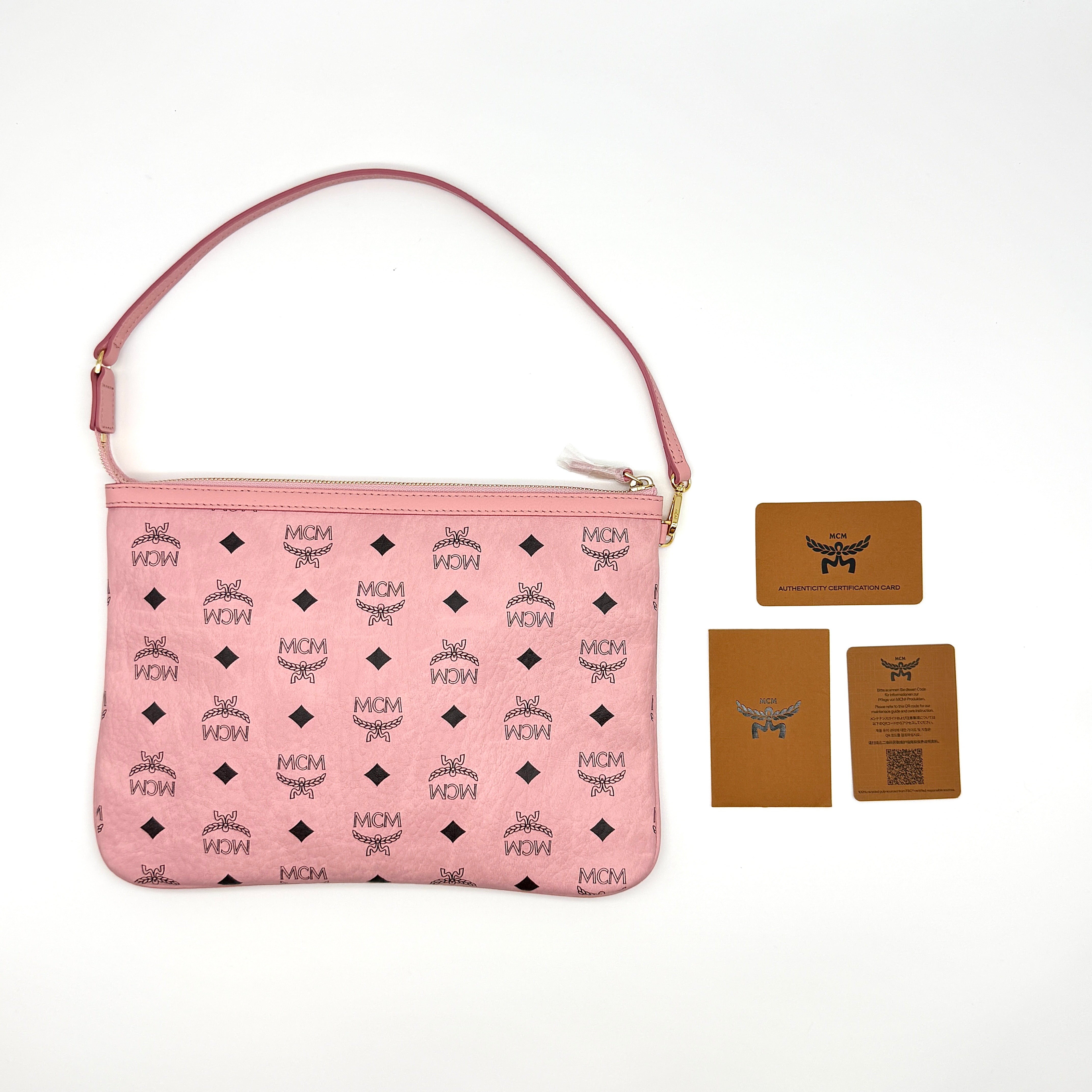 MCM Visetos Monogram Medium Shoulder Bag in pink coated canvas with gold-tone hardware and beige interior lining