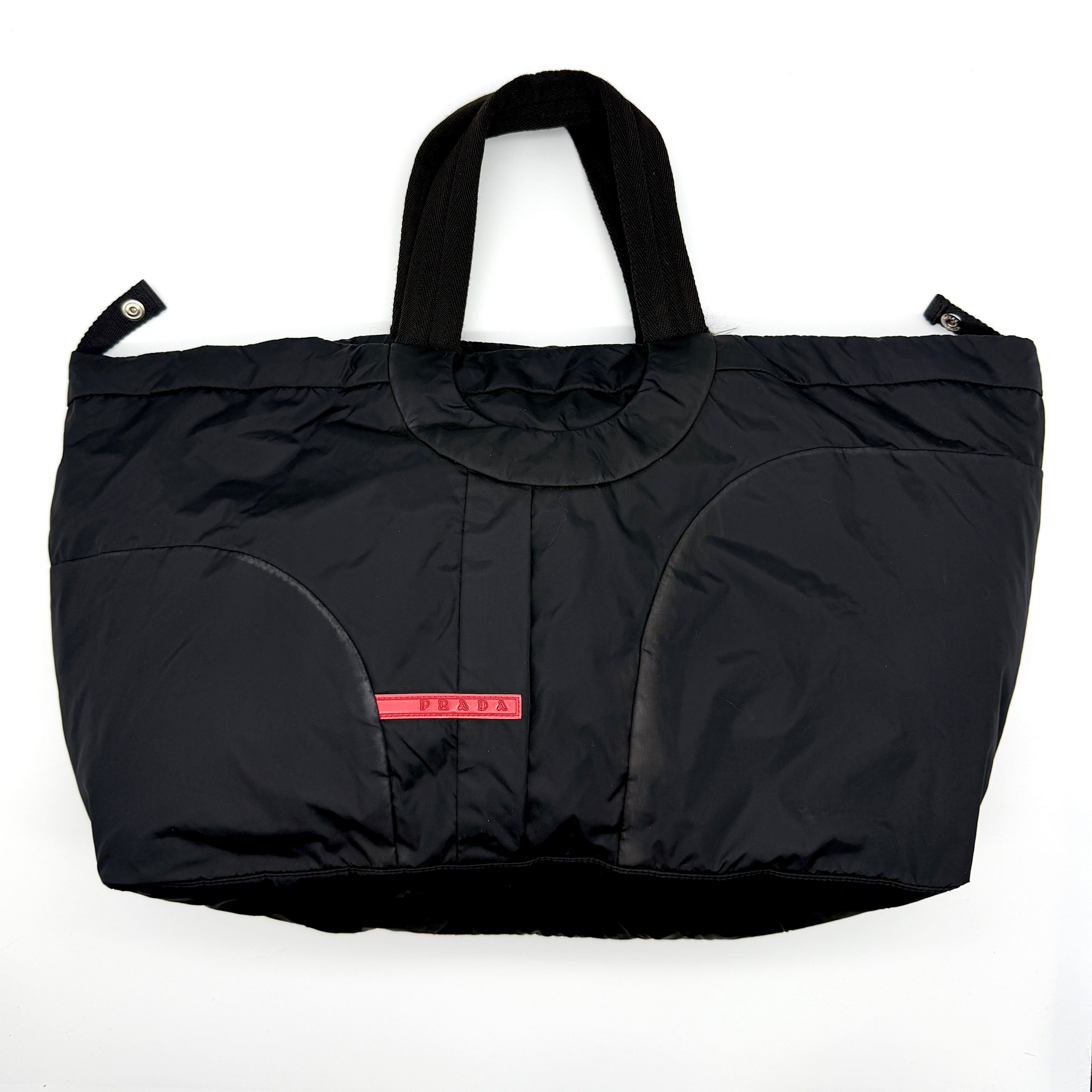 Prada Sport Tessuto Nylon Bag in black with red Linea Rossa logo and dual webbed handles
