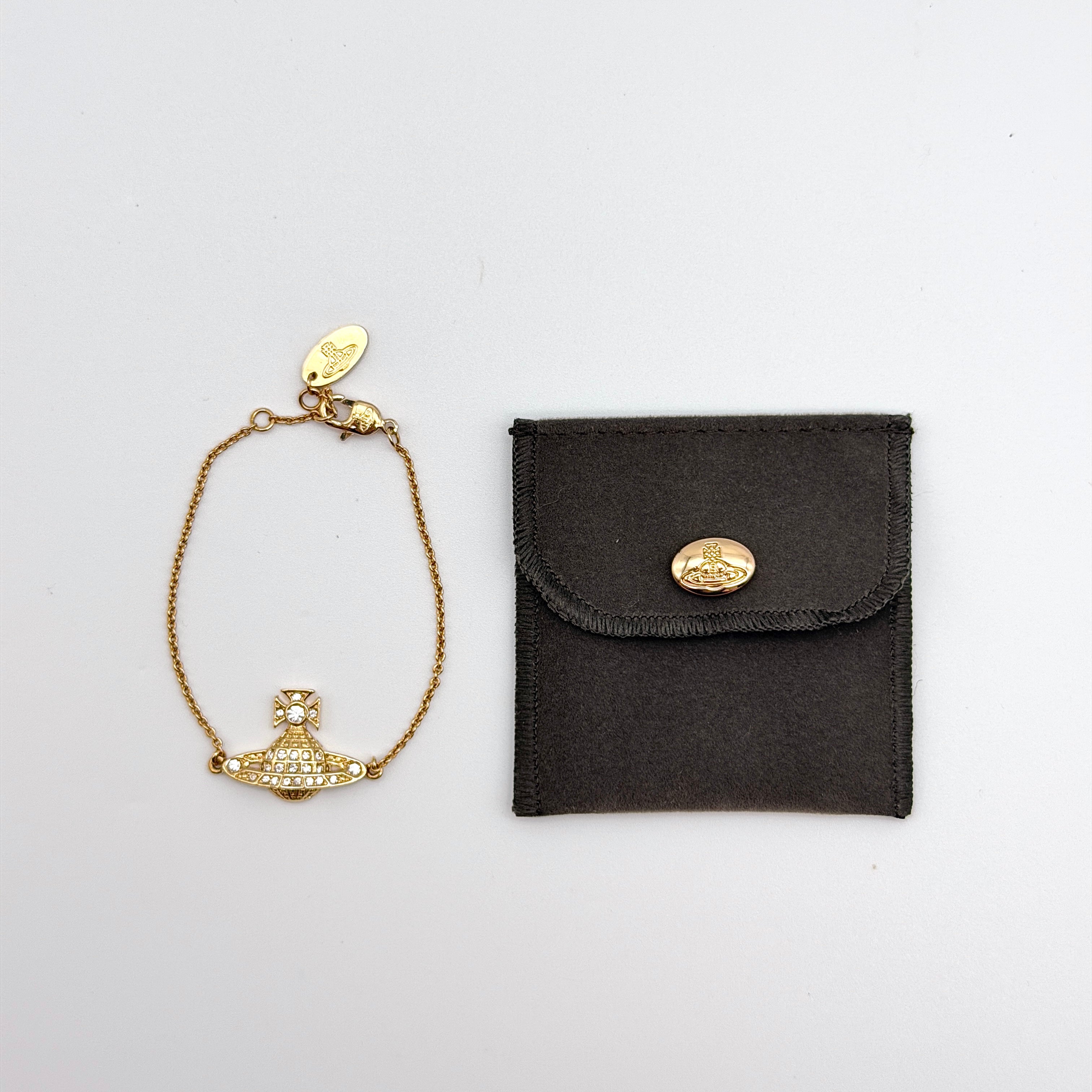 Vivienne Westwood Rhinestone Orb Bracelet in gold-tone metal with crystal accents and original felt pouch