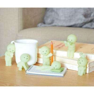 Smiski collectible figure, glow-in-the-dark mini character in quirky poses, perfect for shelves and desks.