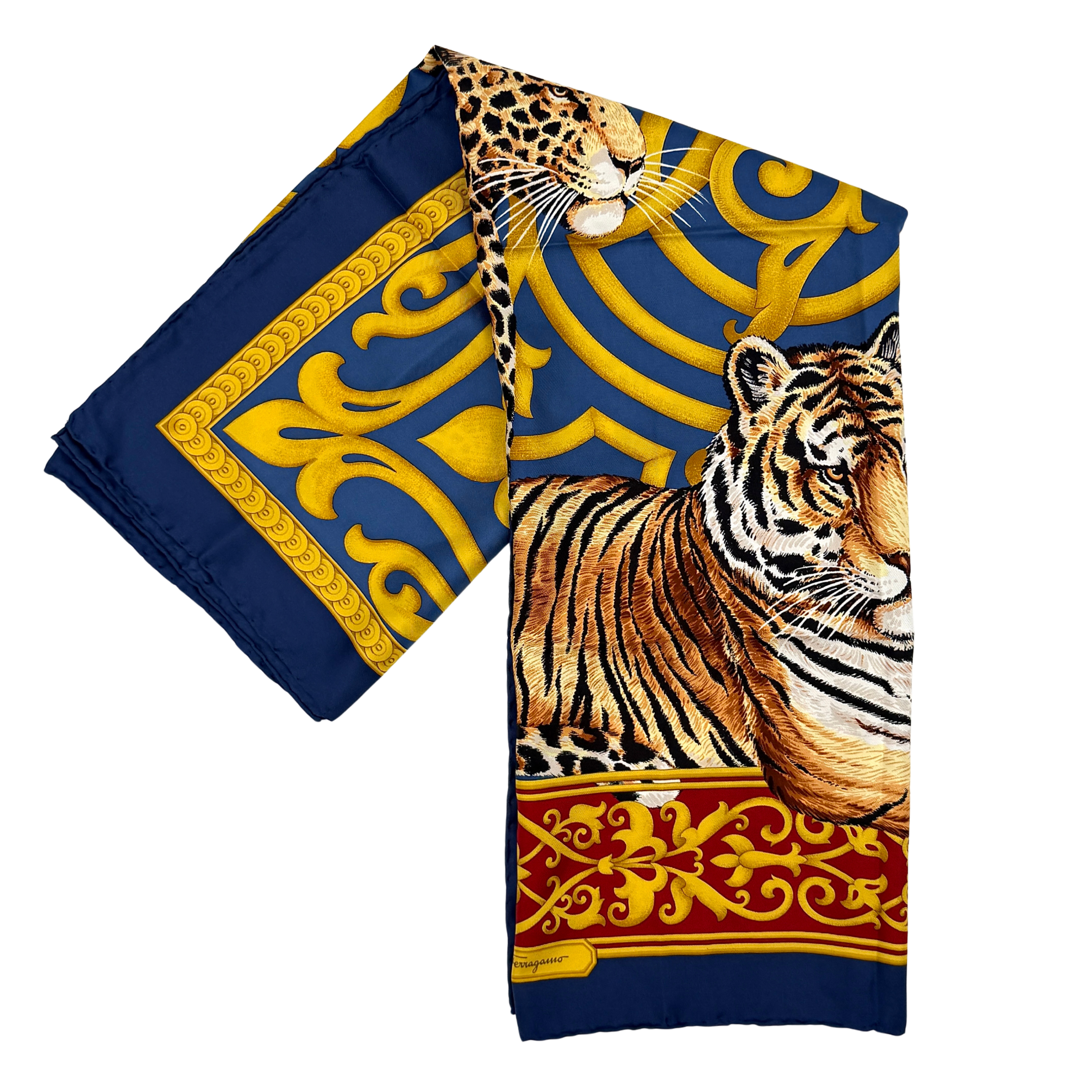 Salvatore Ferragamo silk scarf in gold and navy featuring tiger, leopard and cheetah print with ornate scroll border, shown folded and laid flat.