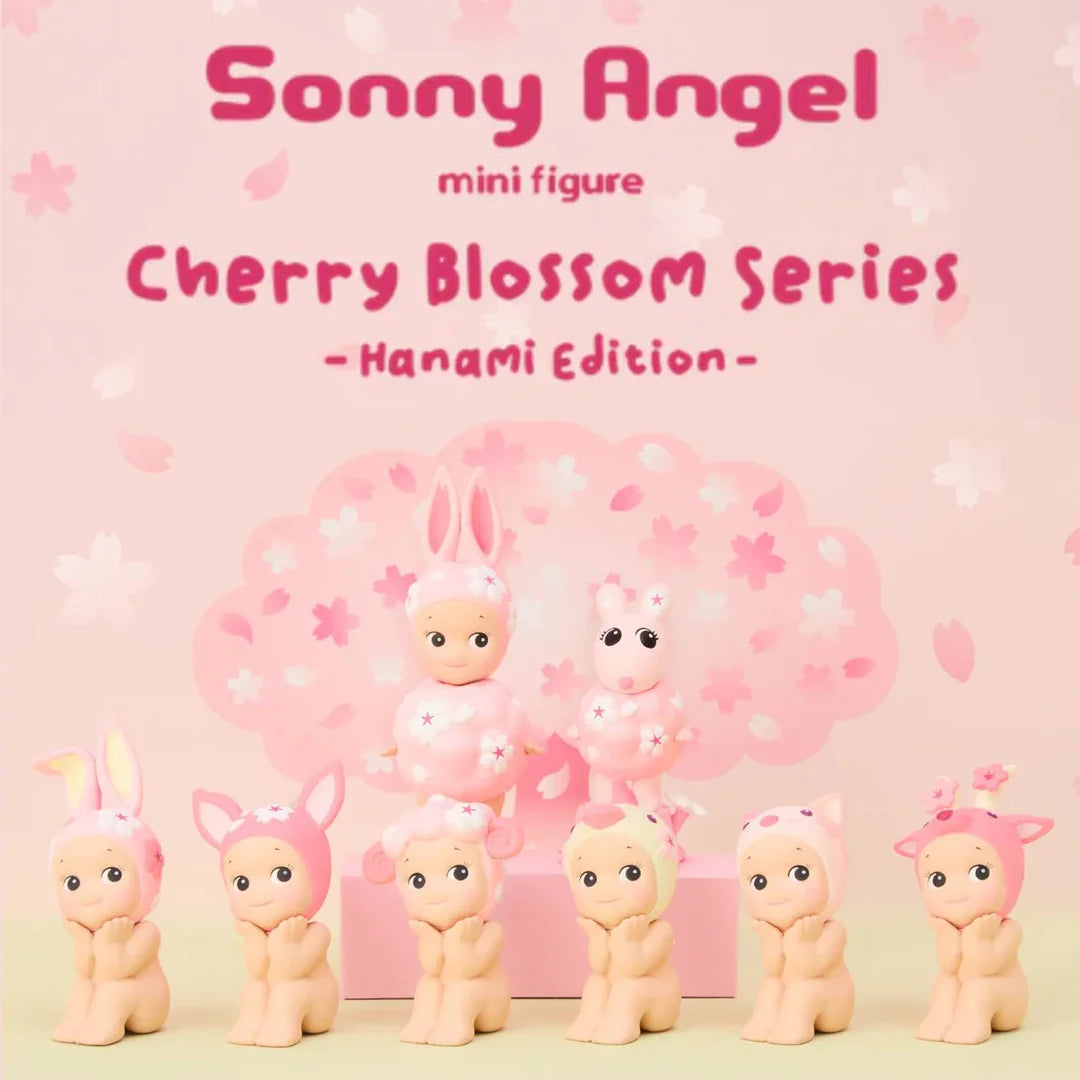 Sonny Angel Hanami Edition mini figures arranged in front of cherry blossom vase in soft pink tones.