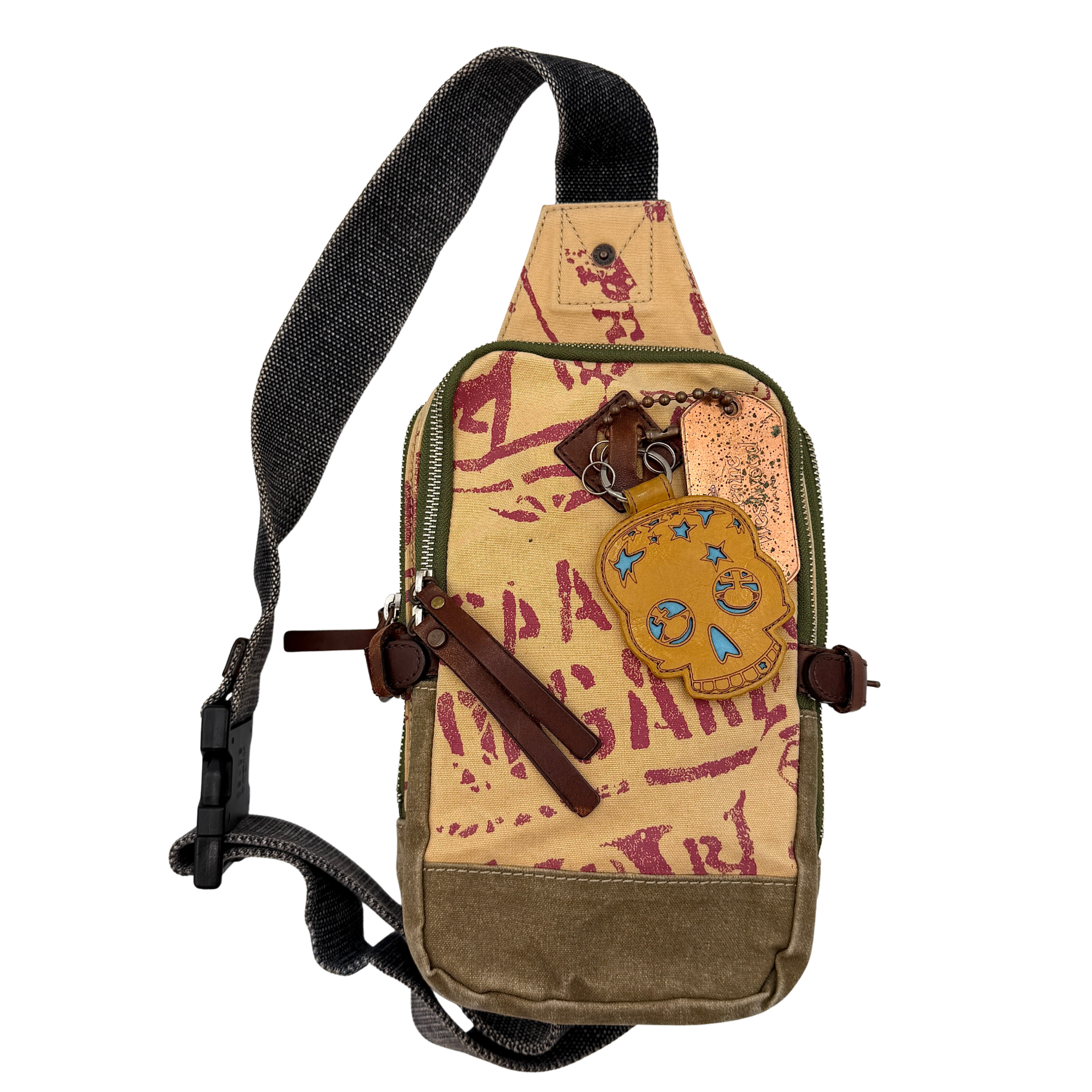 Vivienne Westwood brown canvas sling bag with a skull motif, featuring an adjustable strap and zip closure.