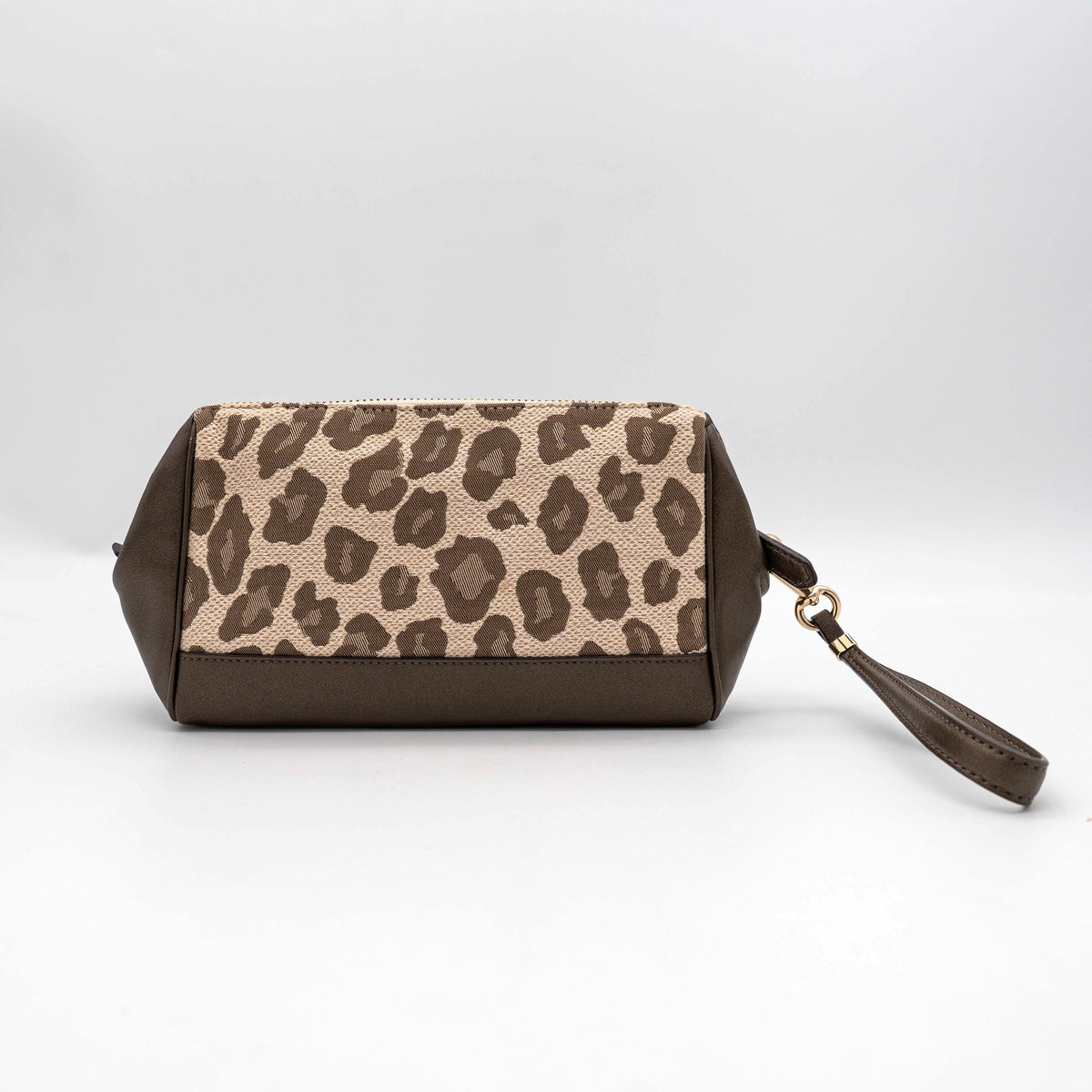 Coach cosmetic pouch in brown and beige leopard print canvas with chocolate leather trim and gold hardware, shown with wrist strap.