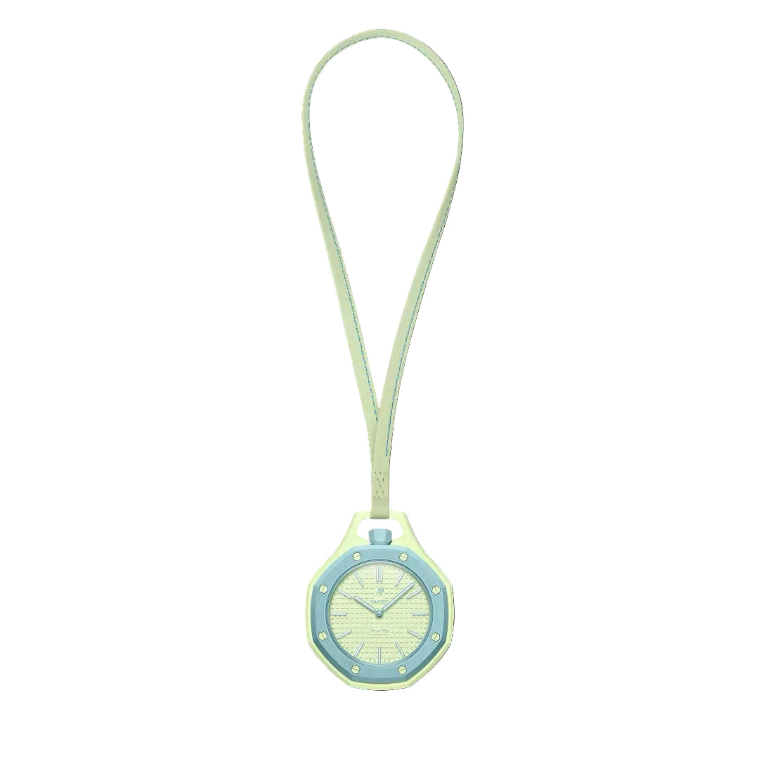 Swatch x Audemars Piguet Royal Pop Blaue Acht pendant watch in pastel green and blue, shown suspended on a matching strap.