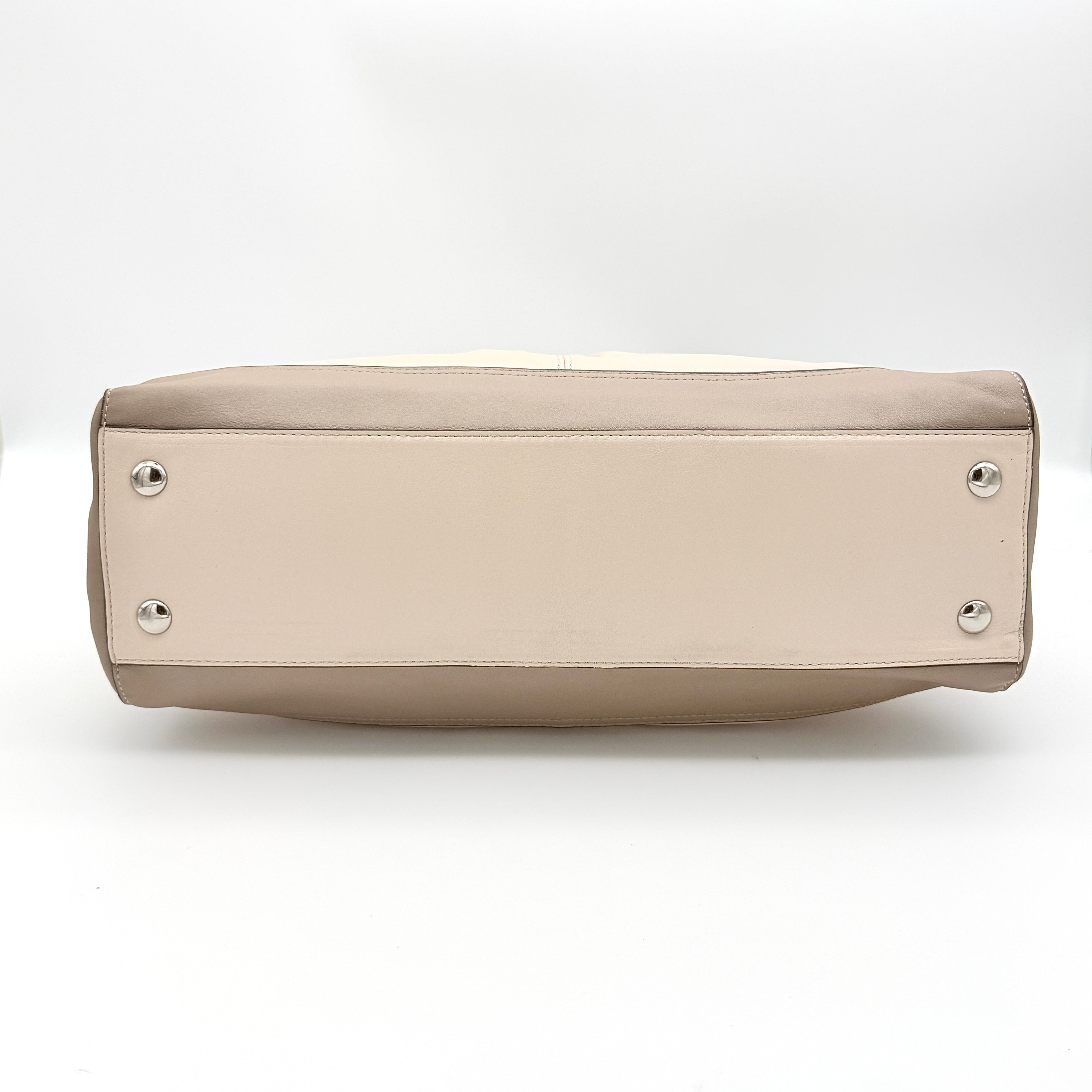 Coach Park Carryall shoulder bag in cream and grey leather with dual handles and silver hardware, photographed on a white background.
