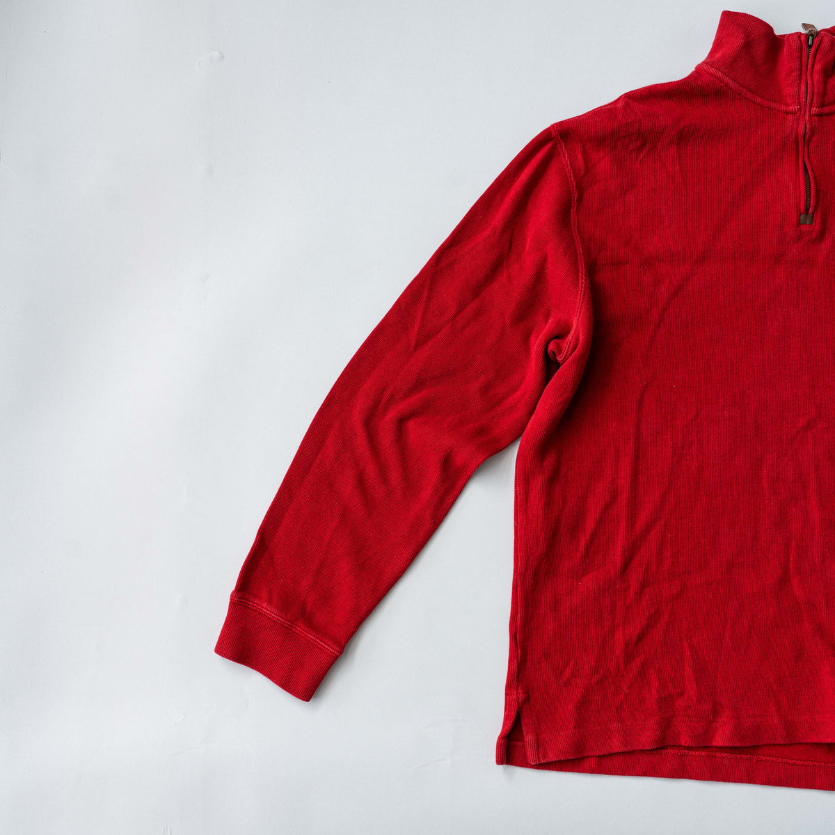 Polo Ralph Lauren red quarter zip mockneck pullover sweater with navy pony embroidery, laid flat on a white background.