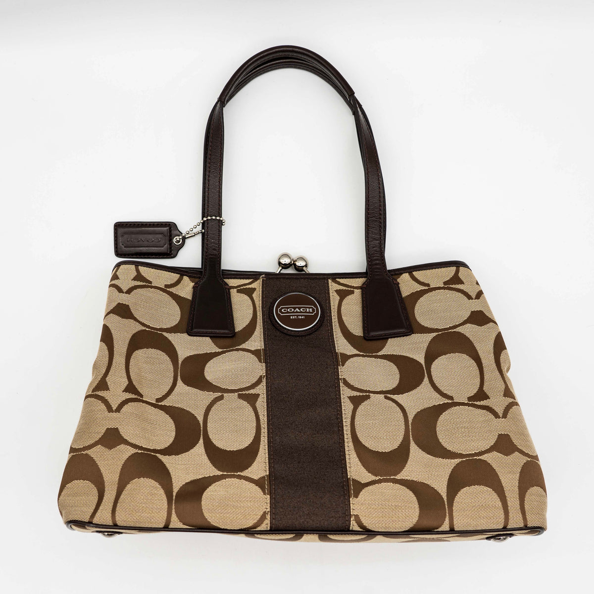 Coach Signature Stripe Frame Kisslock Shoulder Bag in beige and brown canvas with leather trim and signature monogram pattern.
