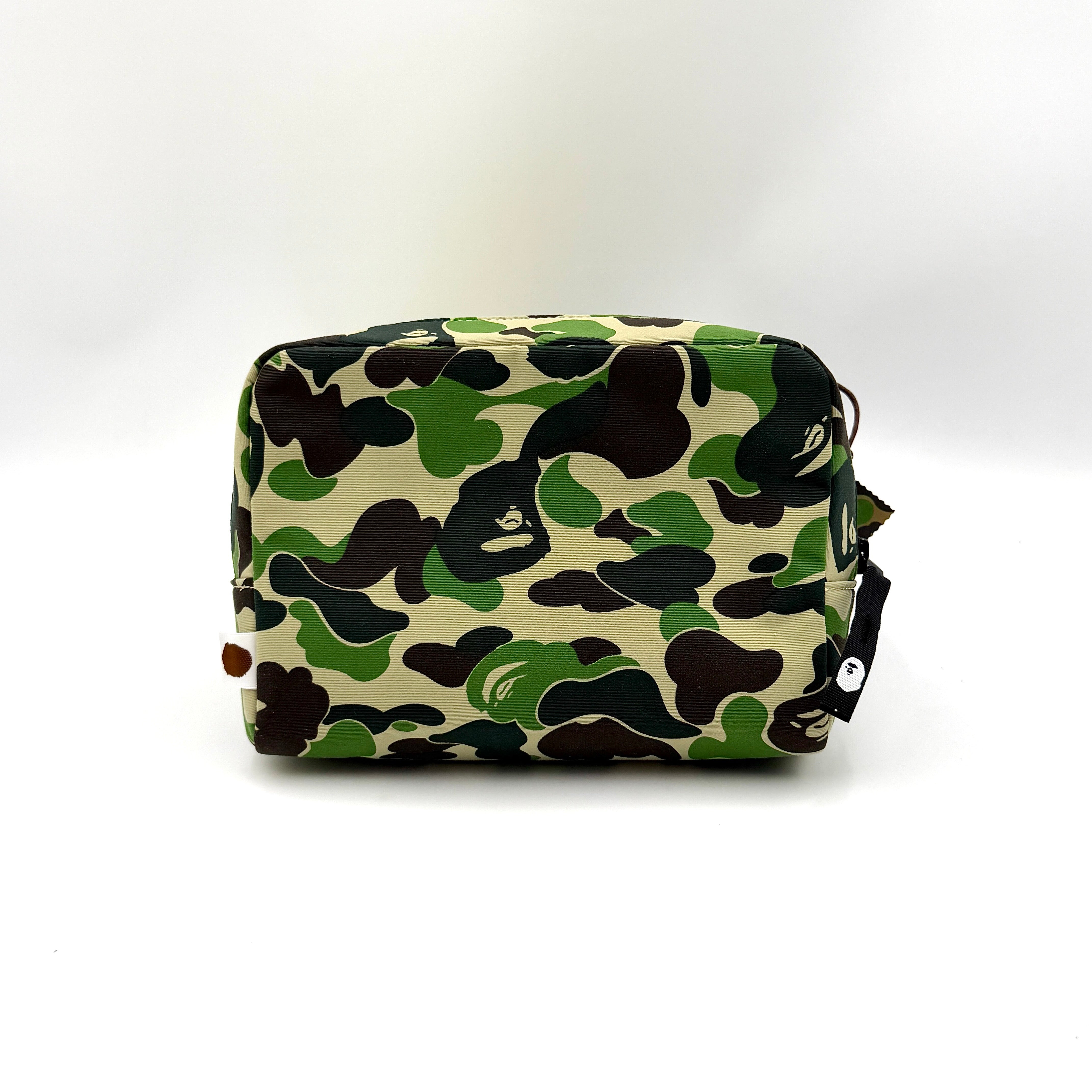 BAPE ABC Camo Pouch in green camouflage with mesh front pocket and embroidered A Bathing Ape logo.