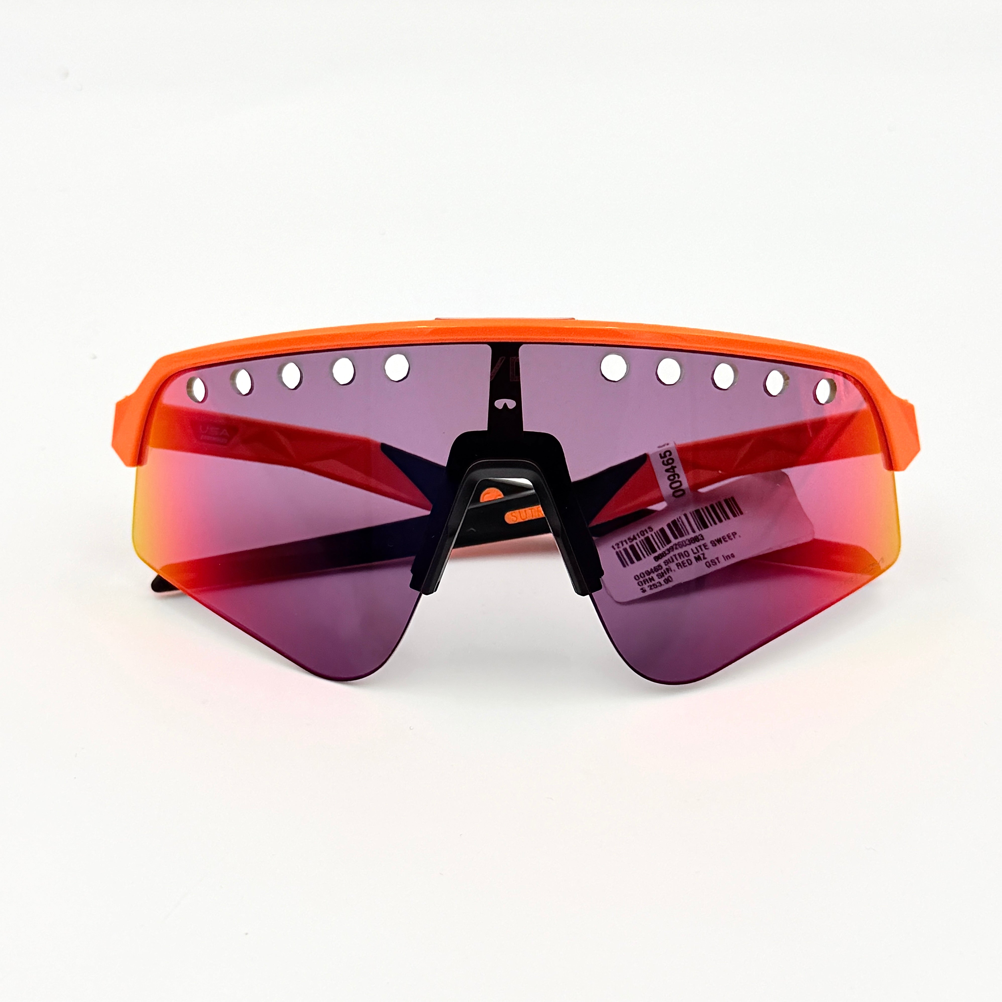 Oakley Sutro Lite Sweep MVDP Prizm Road sunglasses in orange sparkle with a shield lens and original pouch, photographed in bright studio lighting.