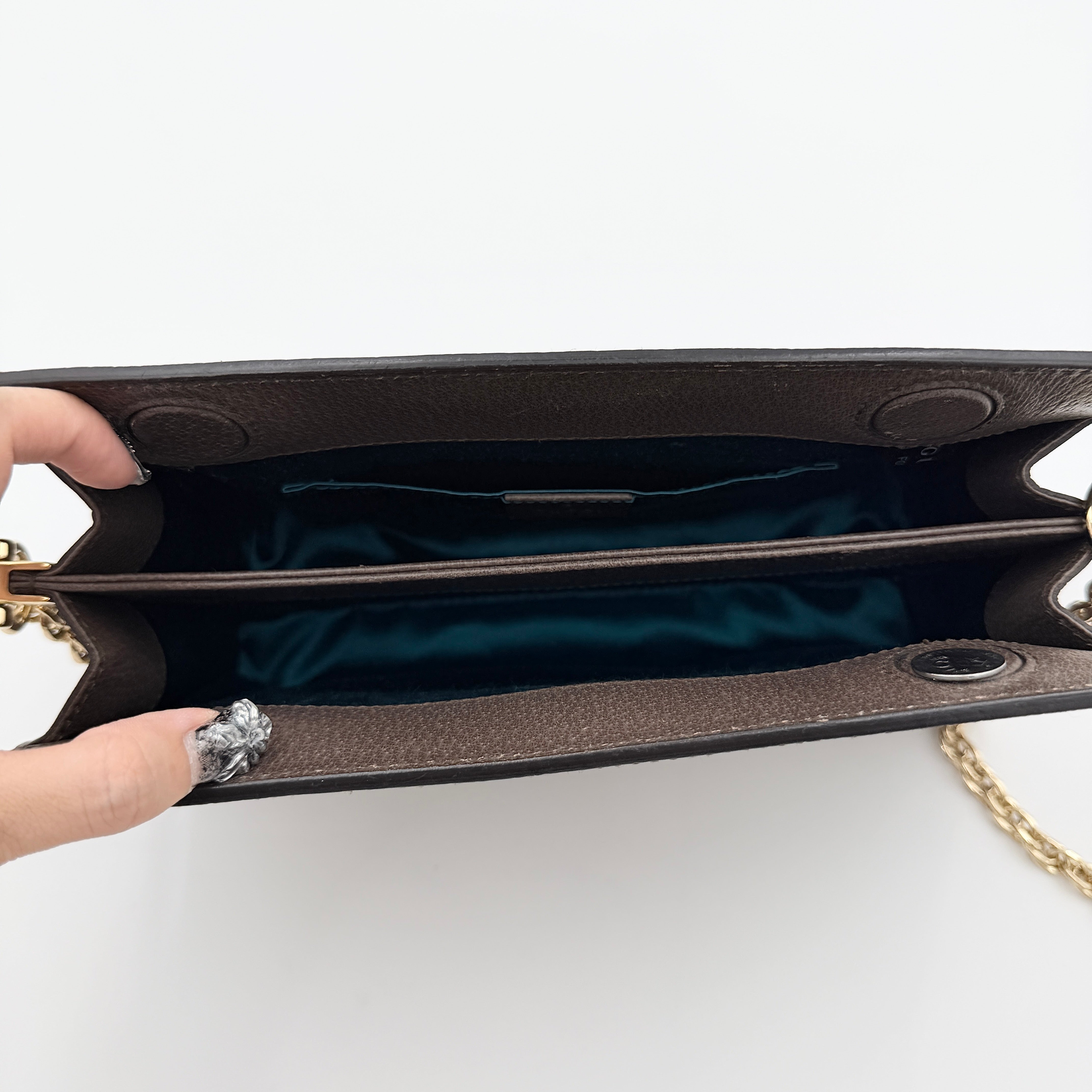 Gucci Ophidia GG Supreme crossbody bag in beige canvas with brown leather trim, signature web stripe, and gold chain strap.