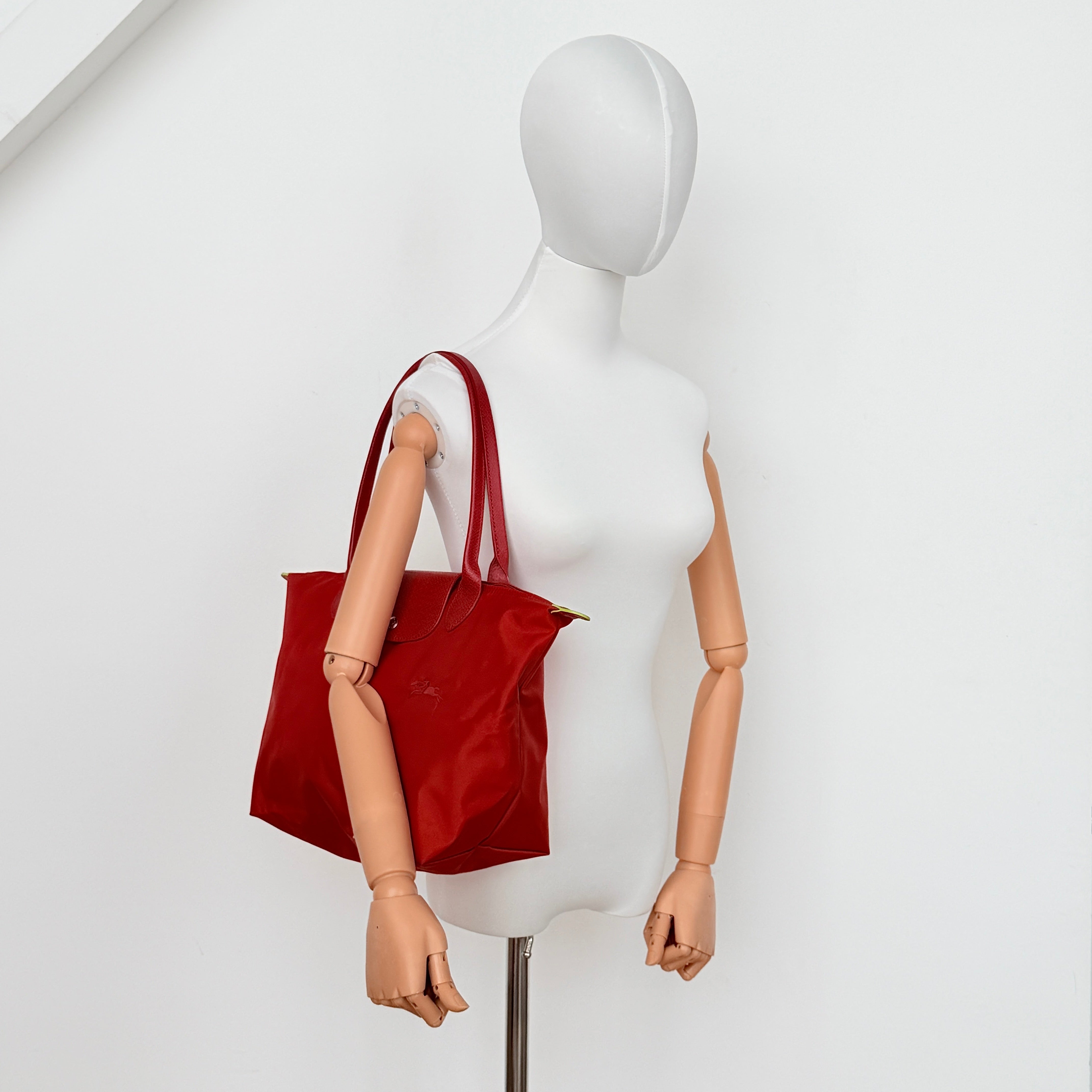 Longchamp Le Pliage Club tote bag in red nylon with tonal leather accents and silver hardware.