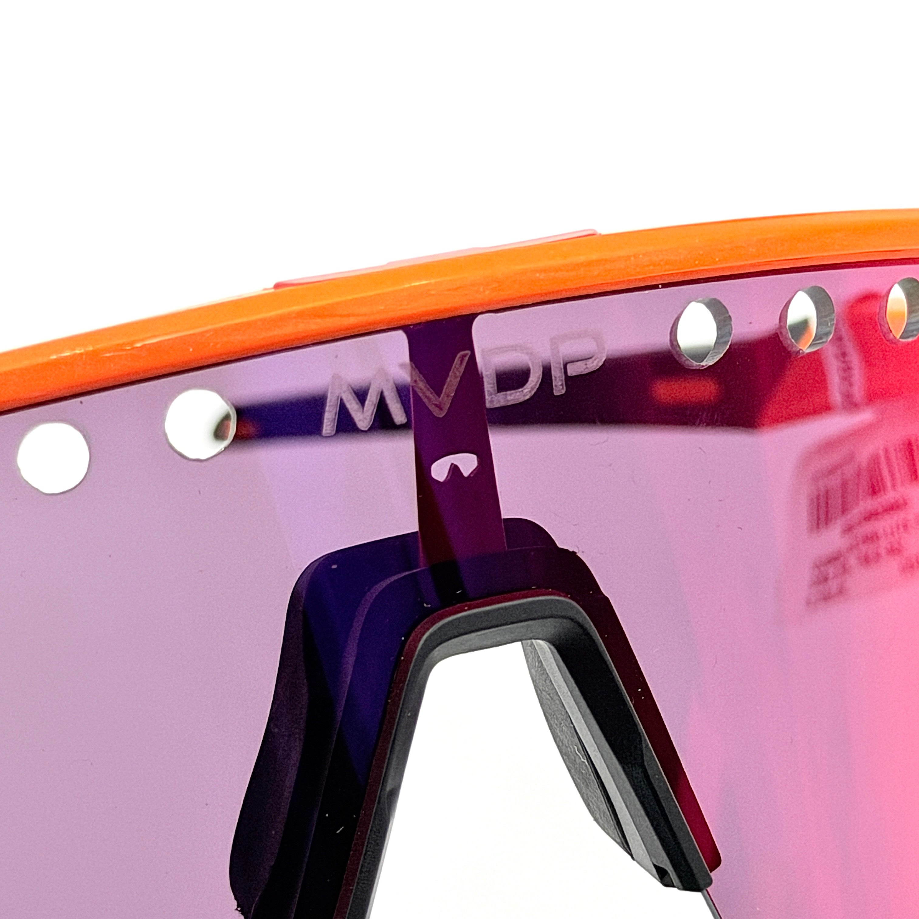 Oakley Sutro Lite Sweep MVDP Prizm Road sunglasses in orange sparkle with a shield lens and original pouch, photographed in bright studio lighting.