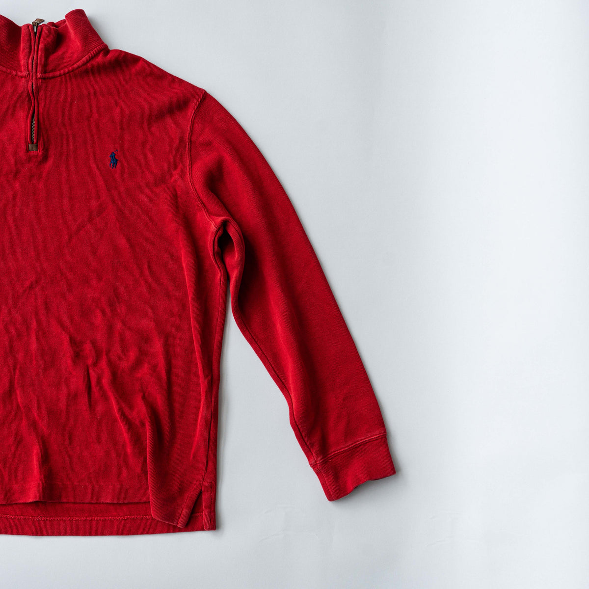 Polo Ralph Lauren red quarter zip mockneck pullover sweater with navy pony embroidery, laid flat on a white background.