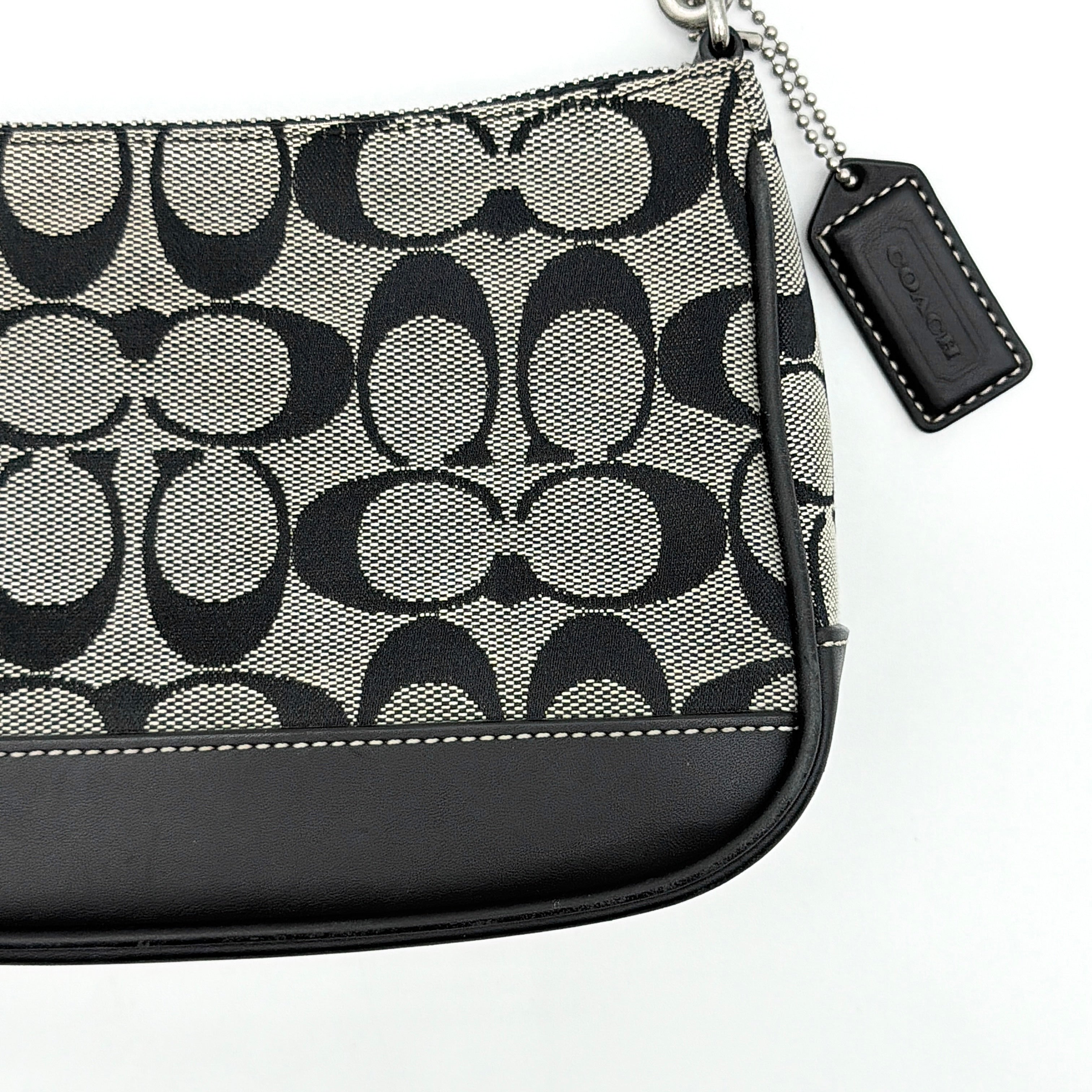 Coach Y2K Demi Shoulder Bag in grey and black signature jacquard with leather trim and silver hardware.