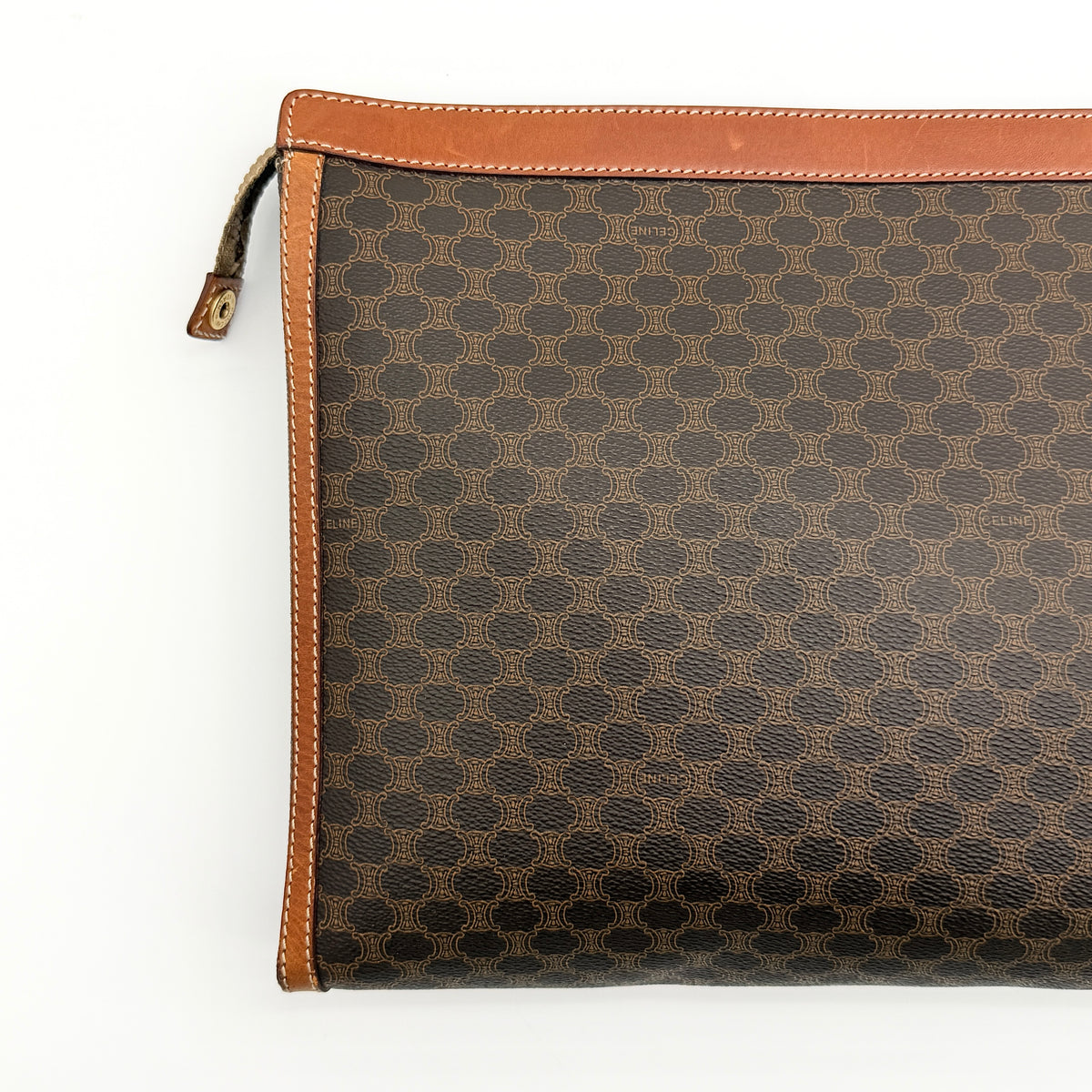 Celine Triomphe Macadam Clutch Bag in brown coated canvas with leather trim, shown against a white background.