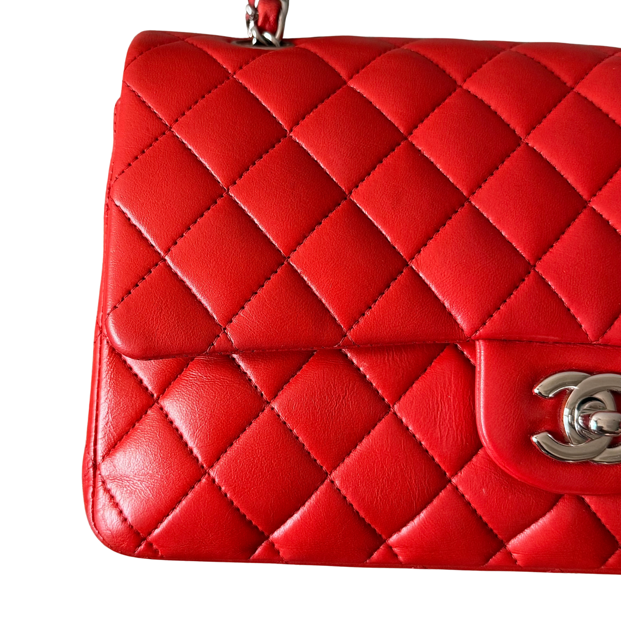 Chanel double flap shoulder bag in quilted red leather with silver-tone hardware and chain leather strap.