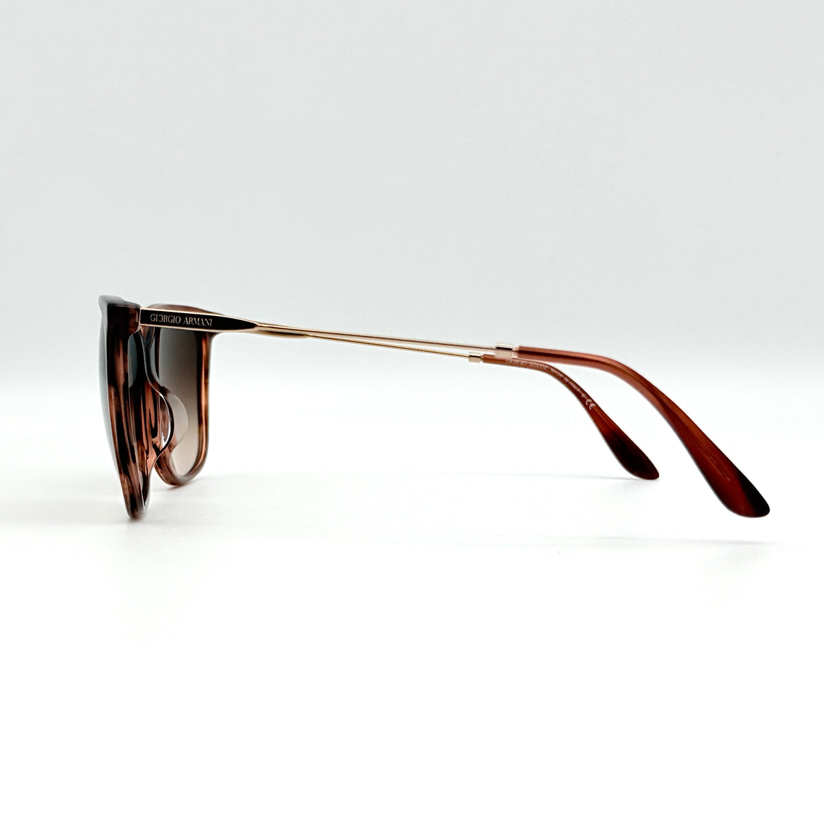 Giorgio Armani AR 8080-F sunglasses in brown tortoise with gradient brown lenses and slim gold-tone arms, displayed at an angle.