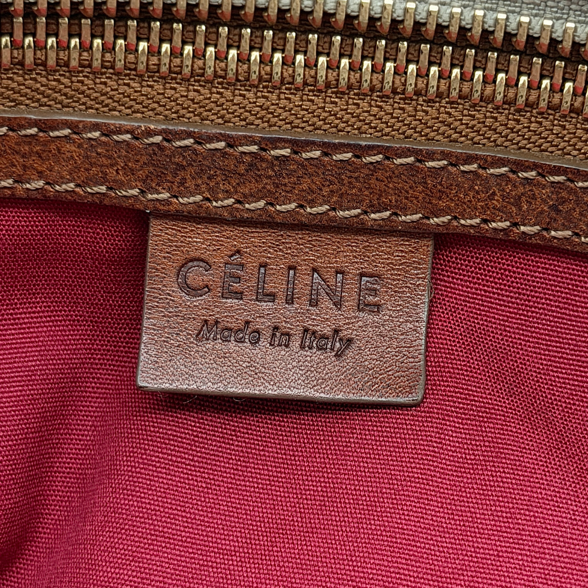 Celine Triomphe Macadam Canvas Tote Bag in beige and brown with leather trim and top handles, styled against a white background.