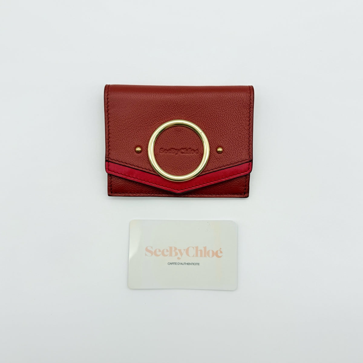 See by Chloé red leather card case with gold-tone ring detail, shown with authenticity card.