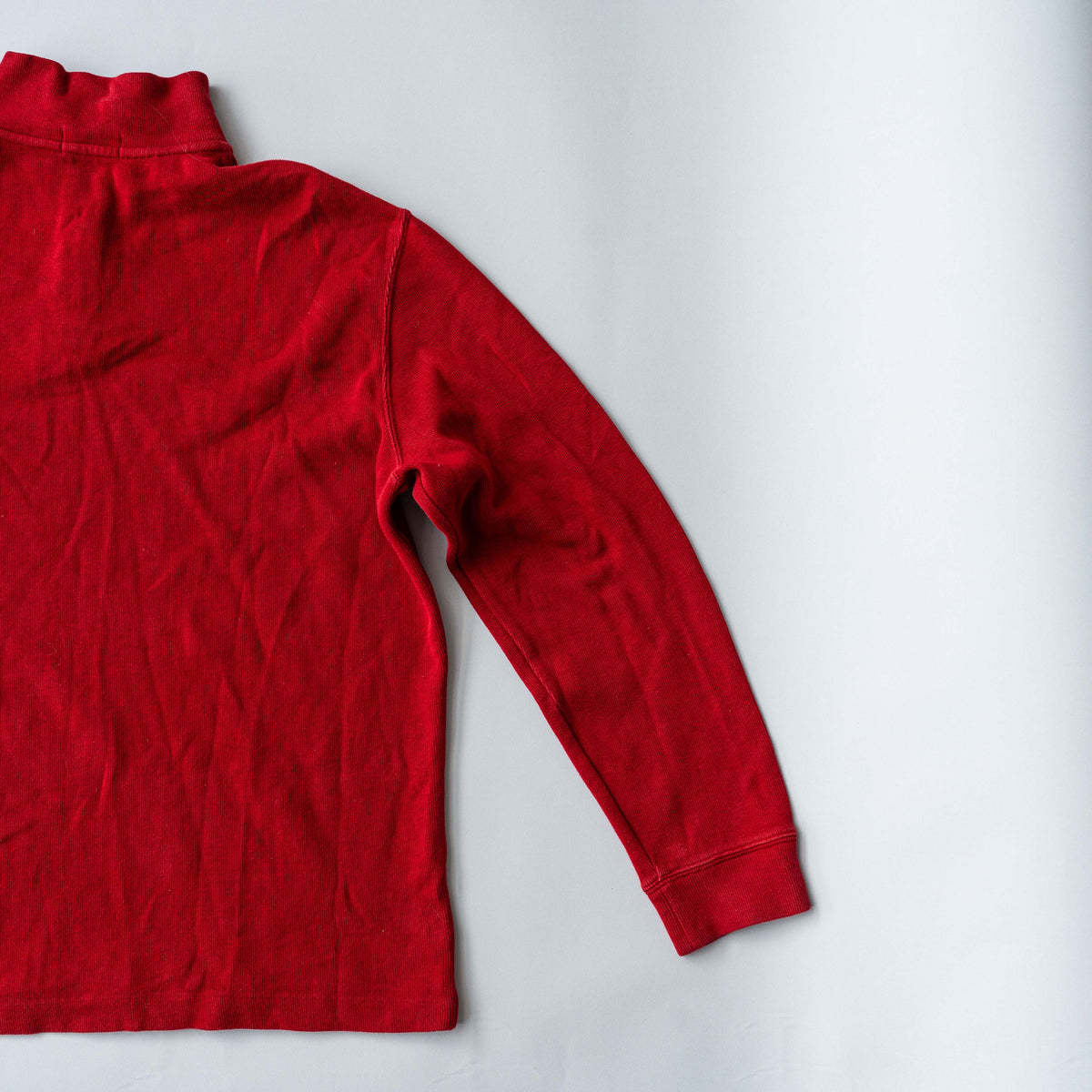 Polo Ralph Lauren red quarter zip mockneck pullover sweater with navy pony embroidery, laid flat on a white background.