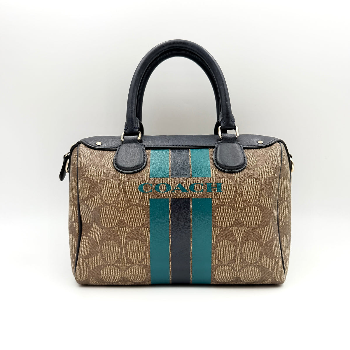 Coach Signature Mini Bennett Boston Bag in monogram canvas with navy and teal varsity stripes and dark navy leather trim.