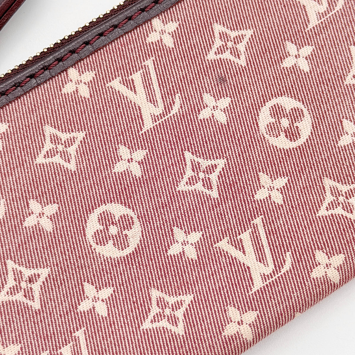 Louis Vuitton Monogram Idylle Pochette Cles Coin Case in sepia pink canvas with gold-tone hardware and monogram pattern.