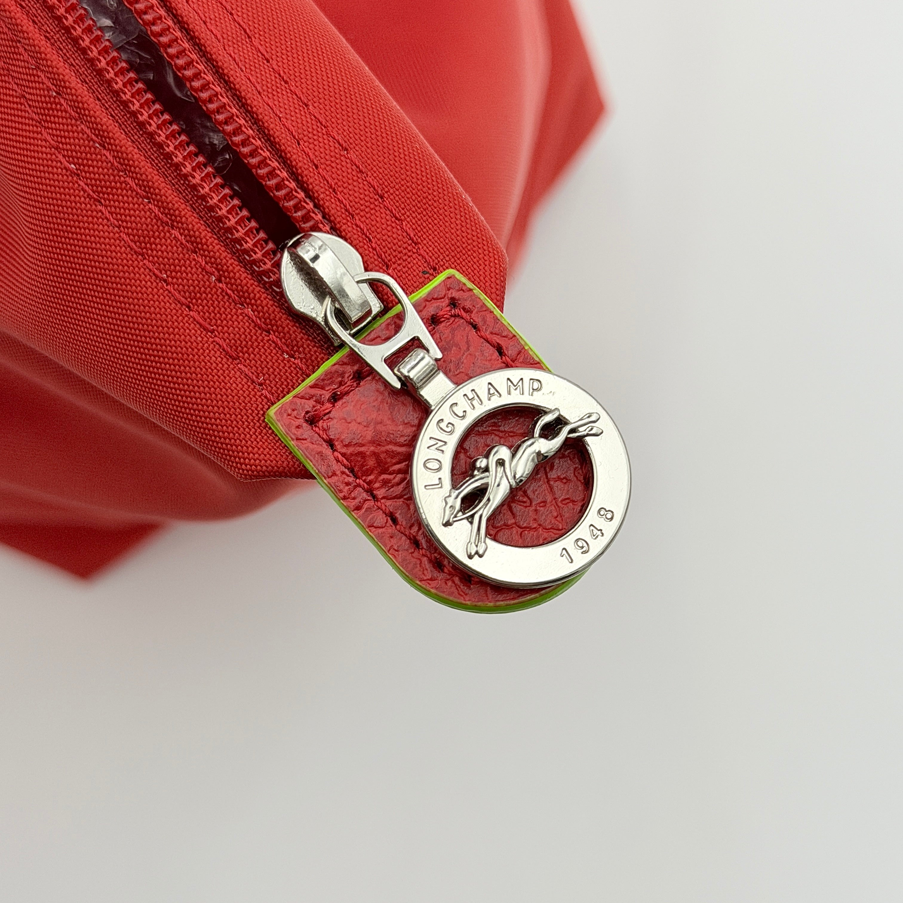 Longchamp Le Pliage Club tote bag in red nylon with tonal leather accents and silver hardware.