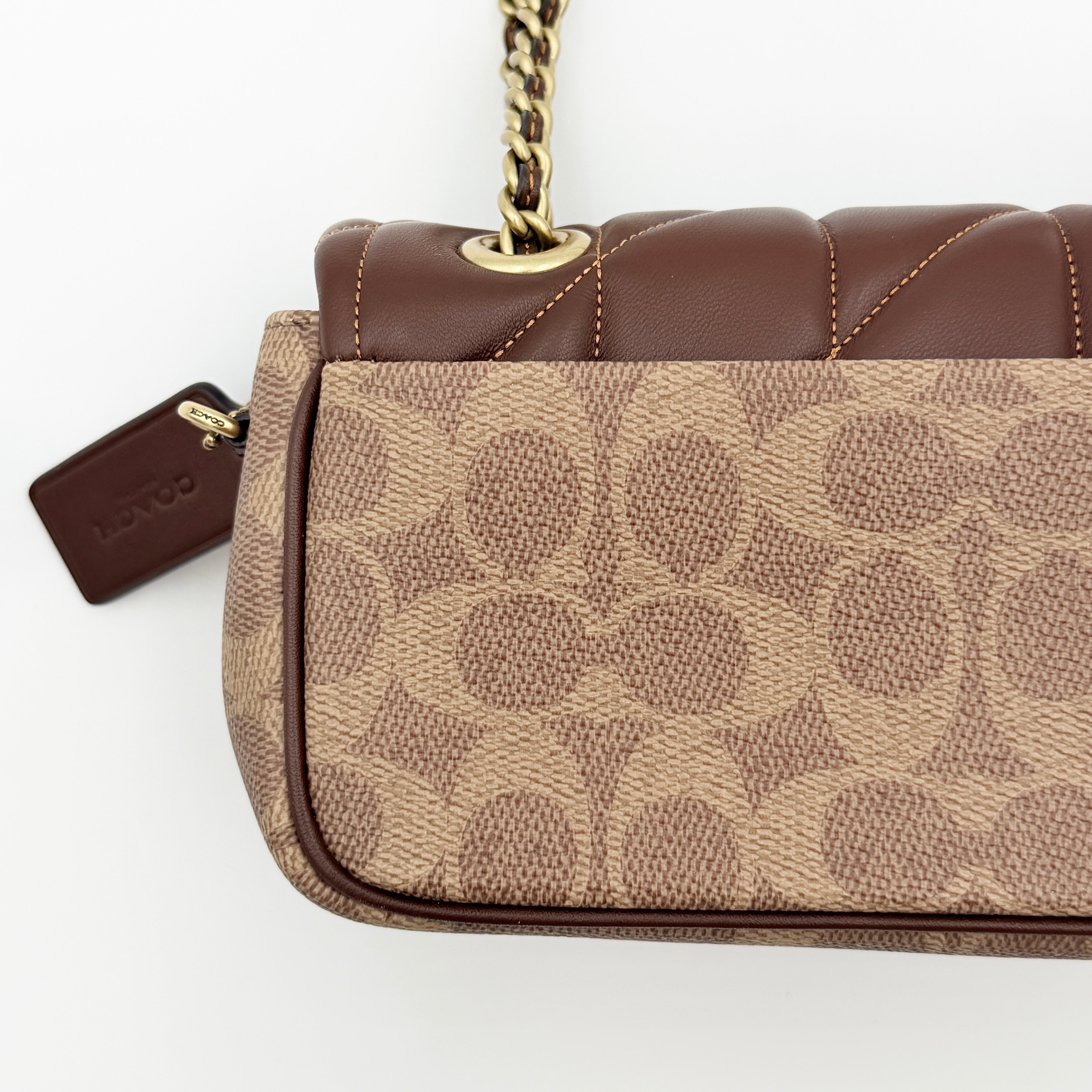 Coach Signature Quilted Tabby Shoulder Bag in brown monogram canvas with gold chain strap and oversized C clasp.