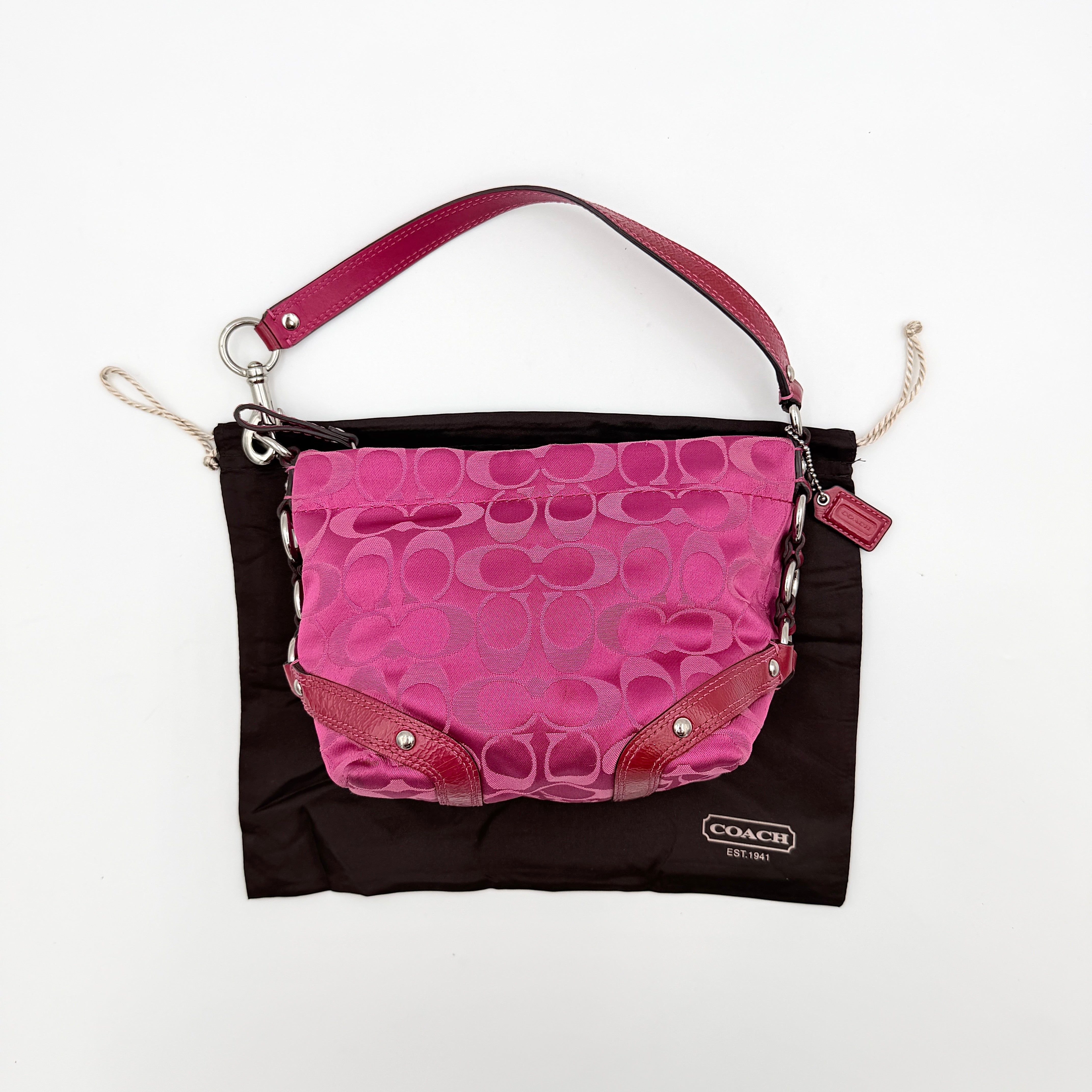 Coach Carly Hobo Shoulder Bag in vivid pink jacquard and leather, featuring signature chain detail and silver hardware.