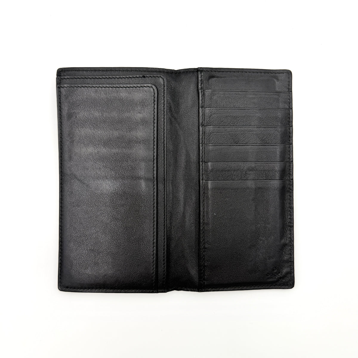 Gucci Guccissima GG embossed long wallet in black leather with box and care card.