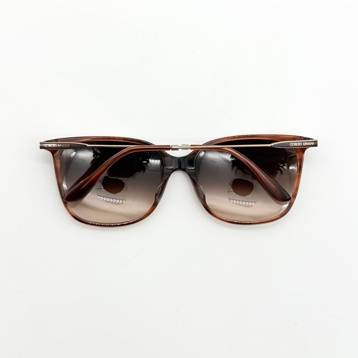 Giorgio Armani AR 8080-F sunglasses in brown tortoise with gradient brown lenses and slim gold-tone arms, displayed at an angle.